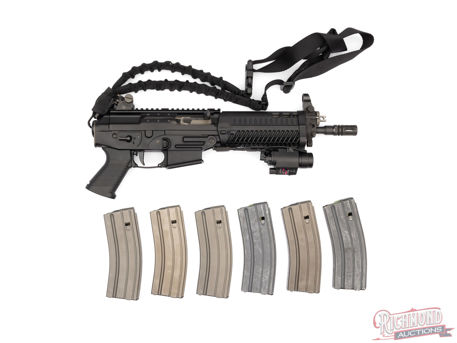 Sig Sauer P556 Pistol 5.56 NATO W/ Accessories: This P556 pistol was made by Sig Sauer and chambered in 5.56 NATO. It features a 9 1/2" barrel with hooded post front sight and adjustable notch rear sight. It is fitted with a polymer handguard with