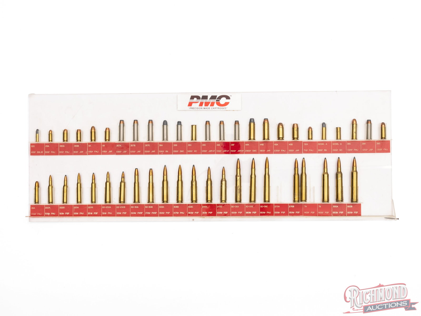PMC Cartridge Sample Display Case: This is a PMC cartridge display that shows 26 straight wall and pistol cartridges and 22 rifle cartridges. There is one 7mm sample missing from the display and the plexiglass case has areas cracked