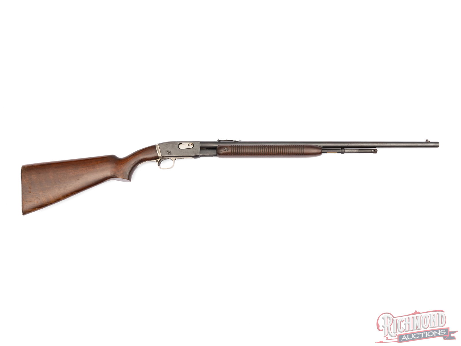 Remington Arms Fieldmaster 121 Slide / Pump Action Rifle In .22 S/L/LR: Manufactured by Remington Arms in March of 1938 according to the date code "AG". Features a 24" blued barrel with rear notch and dovetailed blade front sights. 2/3 barrel length magazine tube for .22