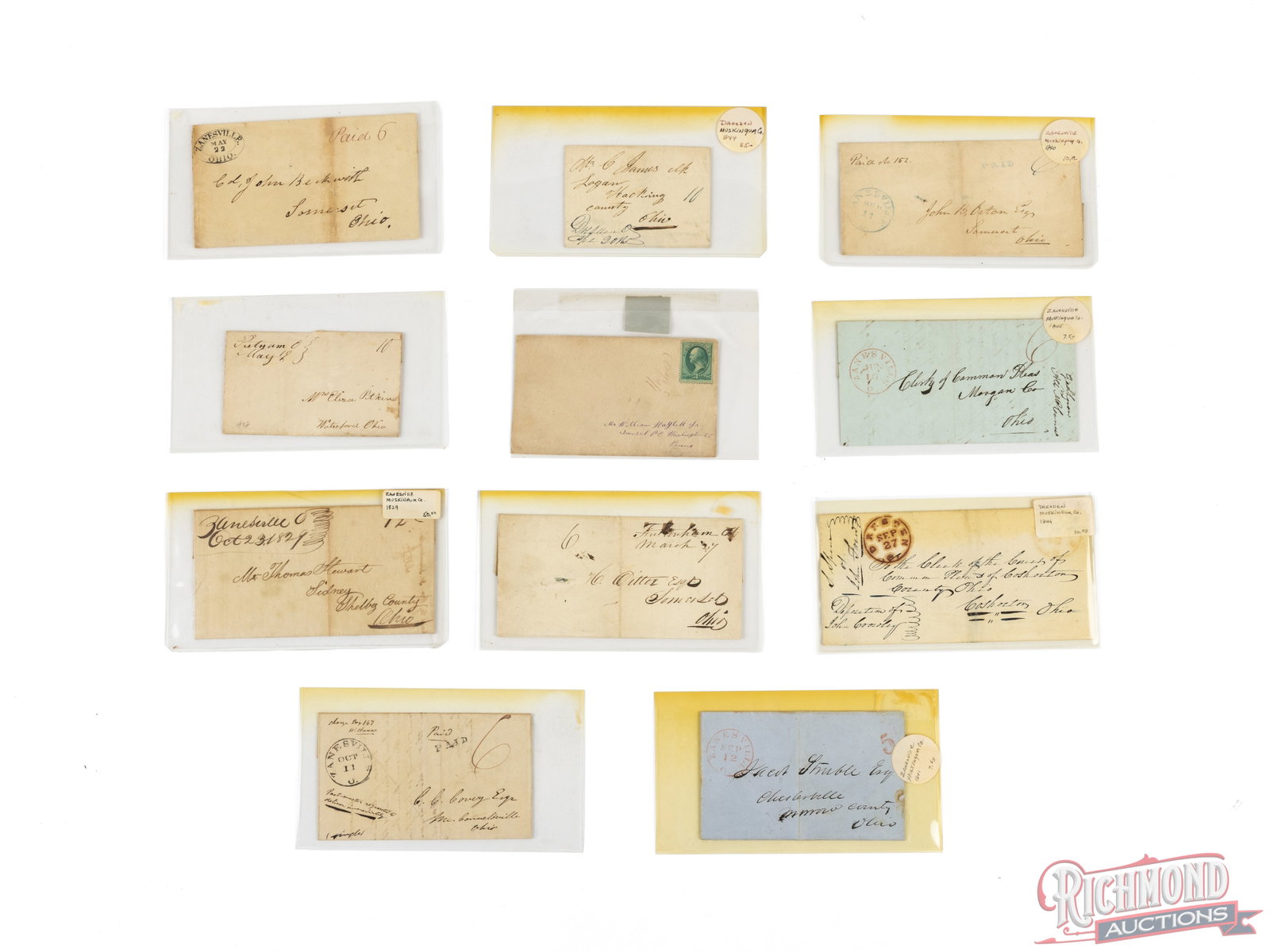 Eleven Stampless Covers From Zanesville, Ohio Dated Early-Mid 1800's: This is a collection of eleven different documents and letters with postmarks of Zanesville, OH. Each letter is protected in a plastic sleeve and individually labeled. Condition GOOD