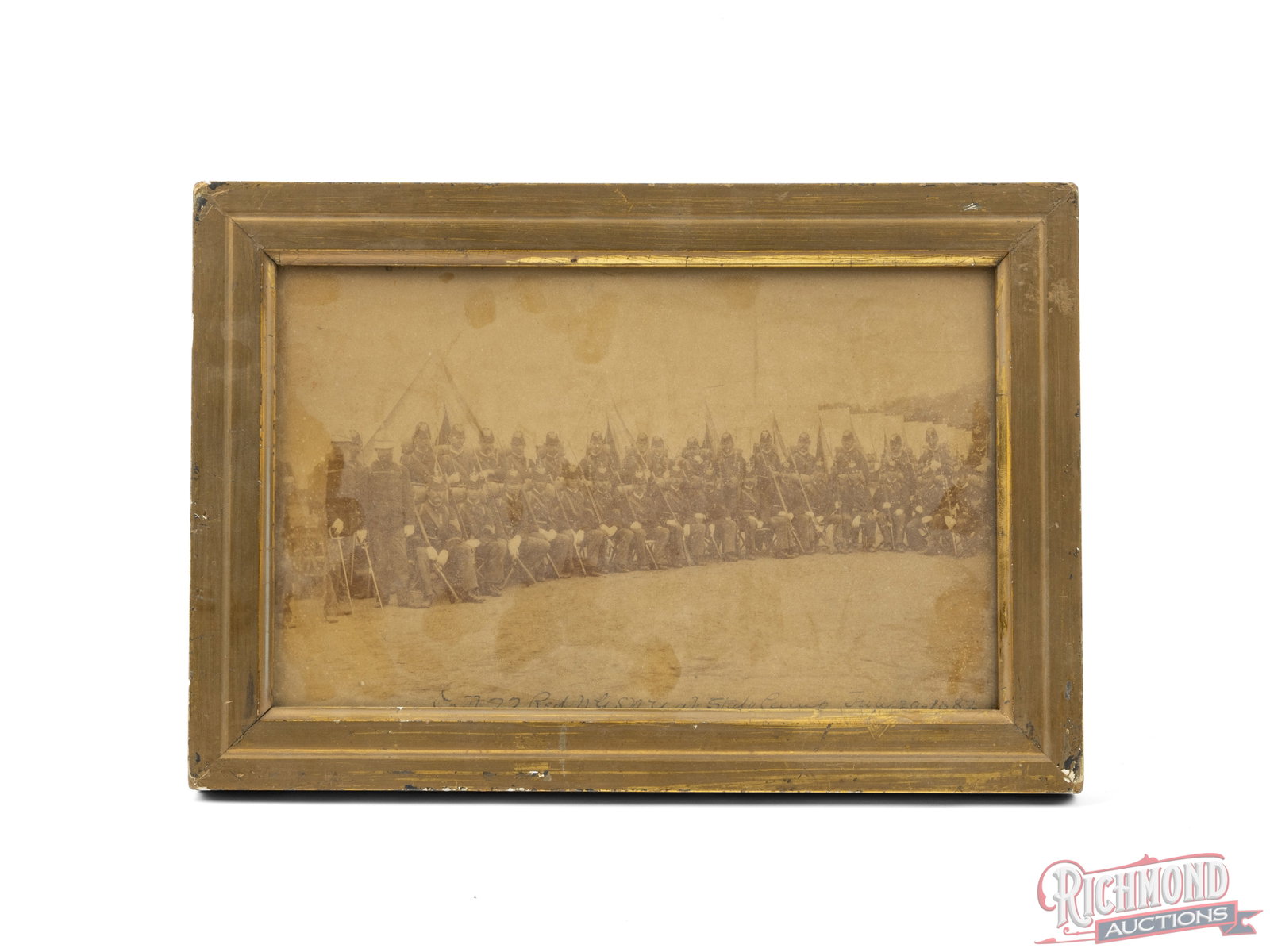 Framed Photograph of The New York State National Guard Circa 1882: This photograph shows troops with their rifles and equipment in their dress uniforms. At the bottom of the photo "Co D 22 Reg NYSNG at State Camp July 29, 1882" is hand written. Condition GOOD
