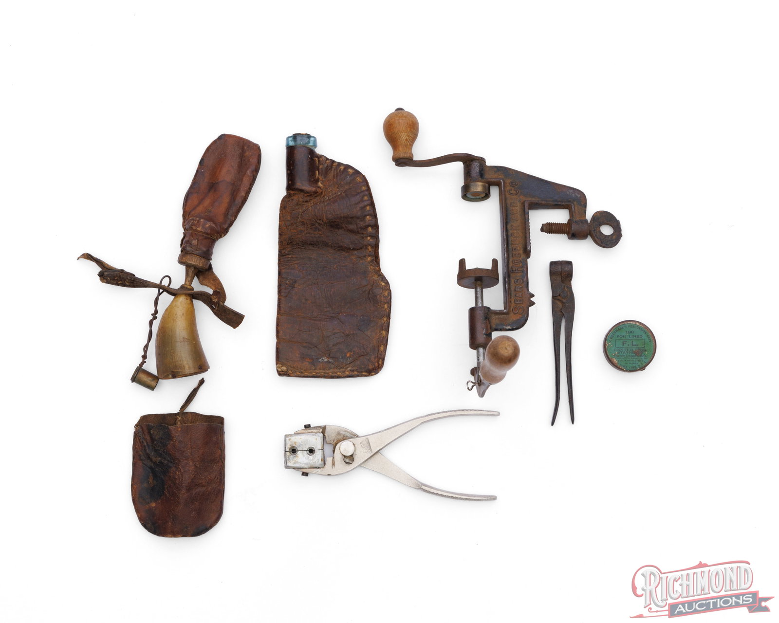 Lot Vintage Leather Powder Flasks, Powderhorn, Bullet Molds & Sears Roebuck Vise Tool: This lot consist of several vintage muzzleloader tools. A modified Sears Roebuck and Co vise, two ball bullet molds, Winchester percussion caps empty tin, leather powder flask with glass reinforced