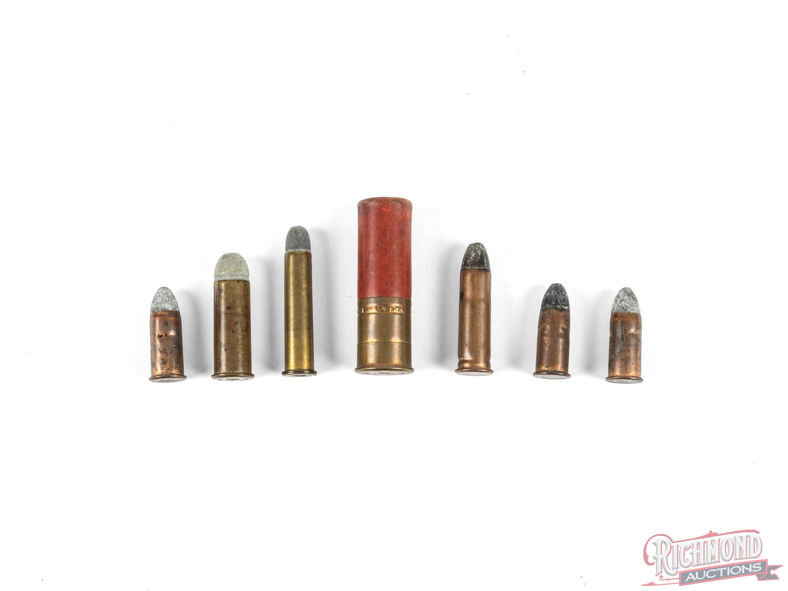 Lot of 7 Vintage Cartridges And Shells Including 8 ga, 56-50 Spencer, And More: This lot contains 7 various vintage cartridges and shells. Included is a Remington UMC 8 gauge Arrow shell, a WRA Co 58 Musket cartridge, a WRA Co marked 45-70 cartridge, and unmarked cartridge that