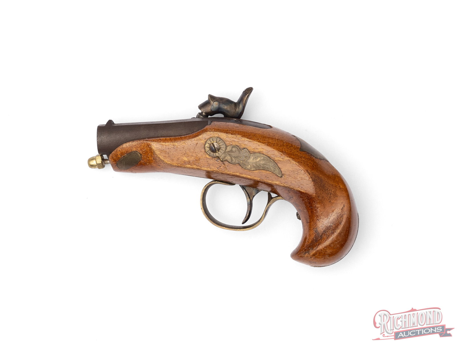 Reproduction Philadelphia Deringer .44 Caliber Pistol: Reproduction Philadelphia Deringer in 44 caliber. Browned 2-1/4" smoothbore .44 caliber flat top barrel with brass floral engraved "Deringer Philadelphia" marked percussion lock. Walnut stock with