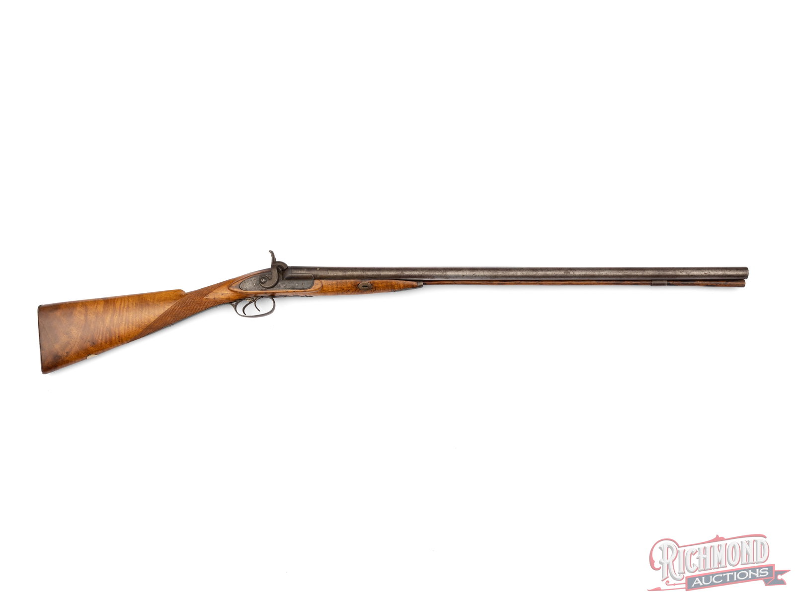 Percussion Muzzleloading 12 Gauge Side by Side Shotgun: Made circa 1850 by unknown gunsmith. Shotgun has 29-1/2" London Twist barrels with bead sight. Gun measures 46" overall with checkered walnut half stock, steel furniture and unmarked percussion locks
