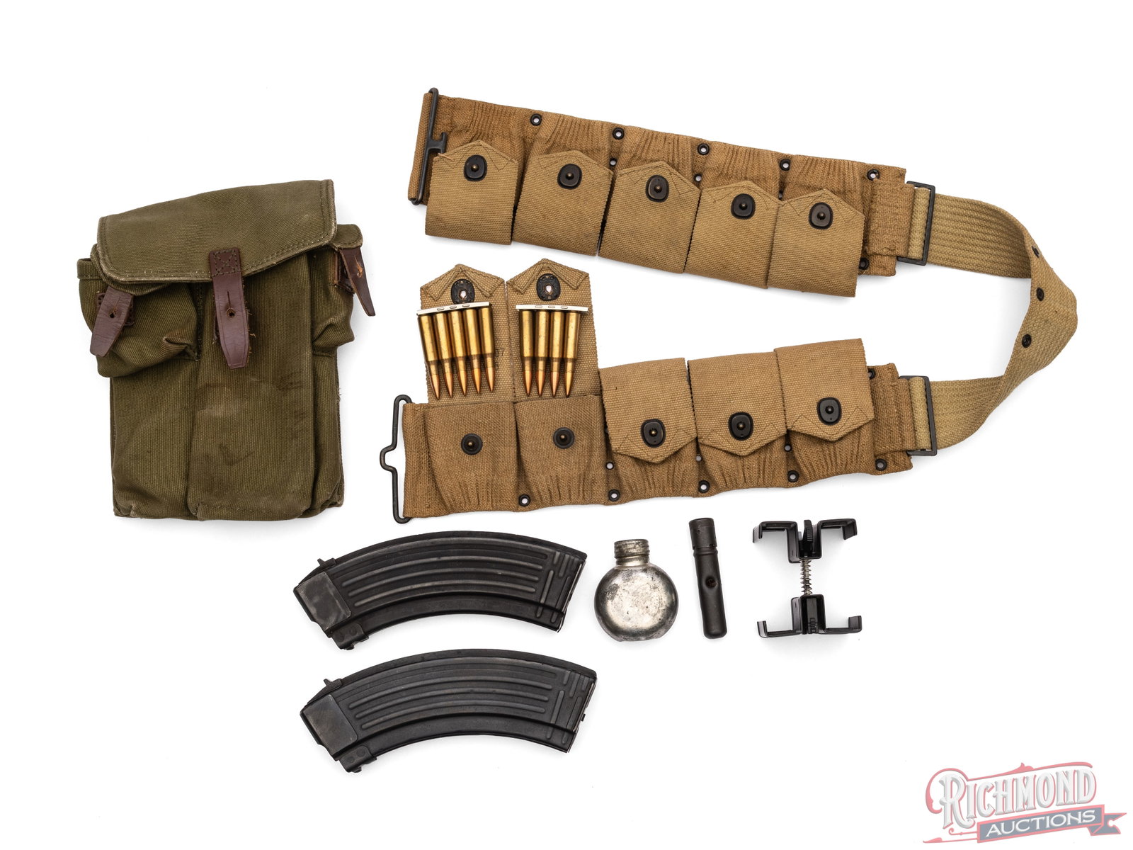 50 Rounds of .308 WIN / 7.62 in Bandolier With Extras: In this lot is a 10 pocket canvas Bandolier/Belt with 10 five round clips of .308/7.62 cartridges with LC headstamps. Also is an AK magazine pouch with two 30-round AK magazines and oiler, and a doubl