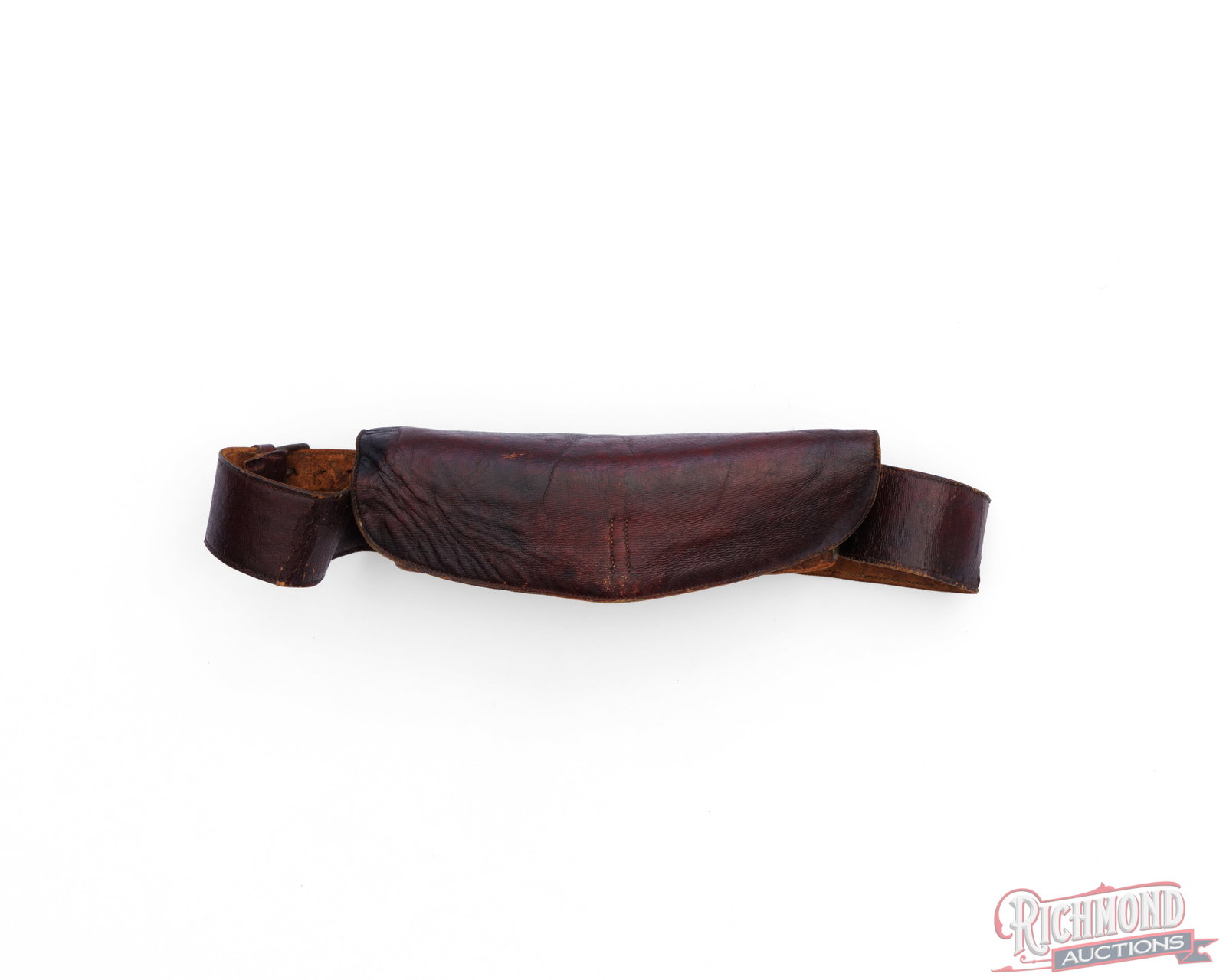 Revolutionary War Era Cartridge Pouch And Belt: This cartridge pouch is made of wood wrapped in leather with a leather belt and possibly from the Revolutionary War Era. The wood has storage for 9 cartridges with a leather flap cover. The leather