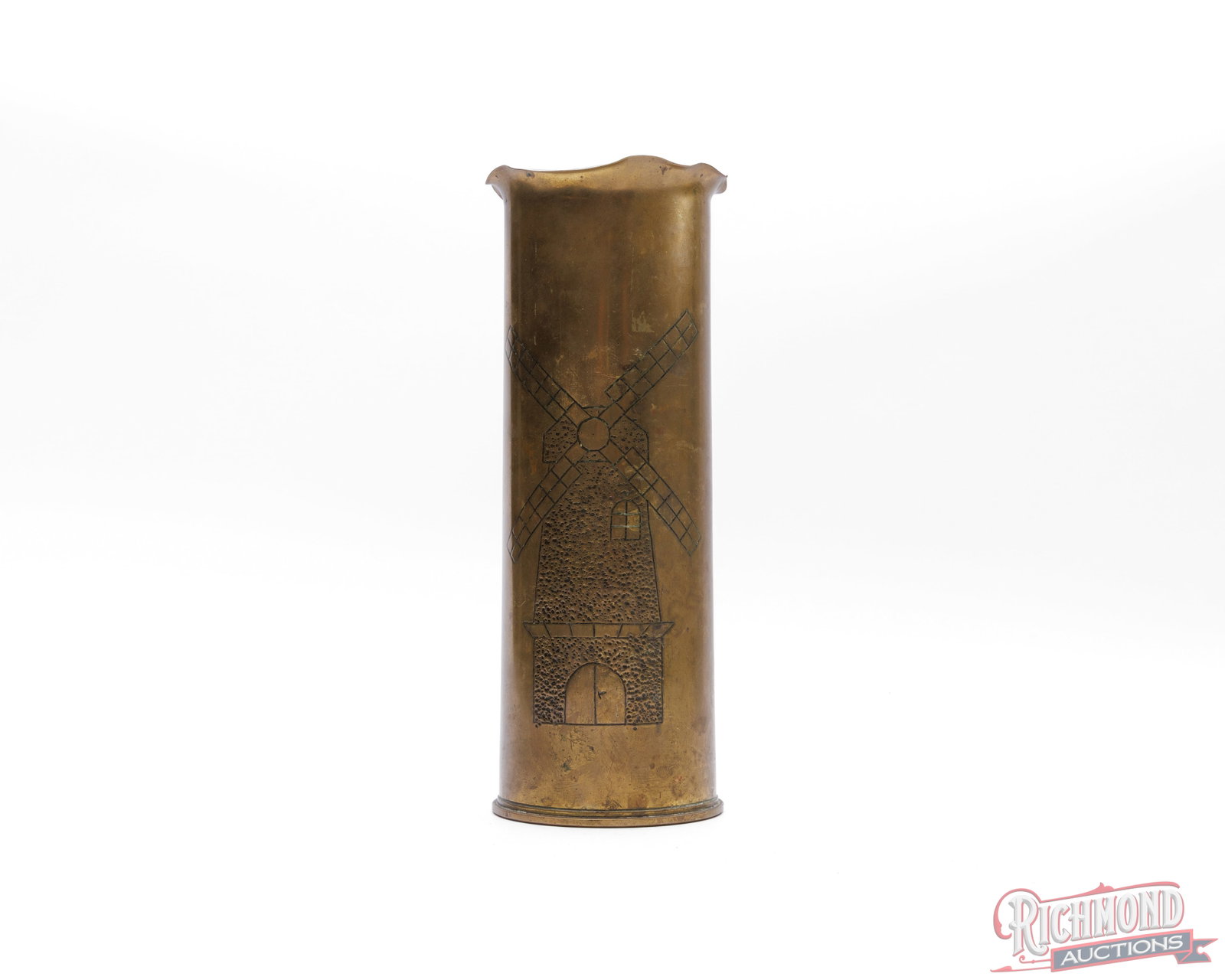 1944 Trench Art Brass British Artillery Shell With Dutch Windmill: Bottom of the shell is stamped "1944 CF / RLB / 25Pr". Measures 4" in diameter and stands 11-1/4" tall. Carved and stippled Dutch windmill art with rippled top edge. Likely used as a faux flower