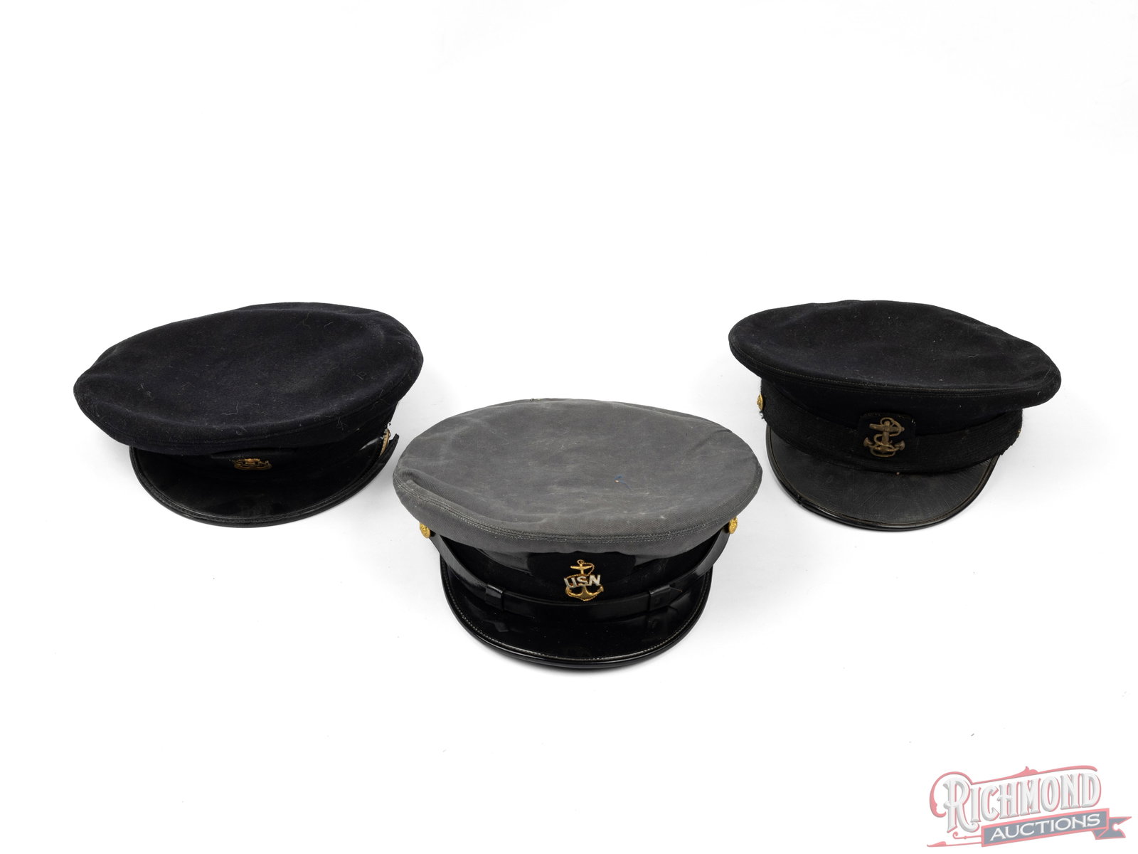 Collection of Three US Navy Caps: This is a lot of 3 different US Navy caps. Included is one gray cap made by Art Caps and has the name D.C.Caraley inside, a black cap labeled inside "The Severn", and a second black cap with "This