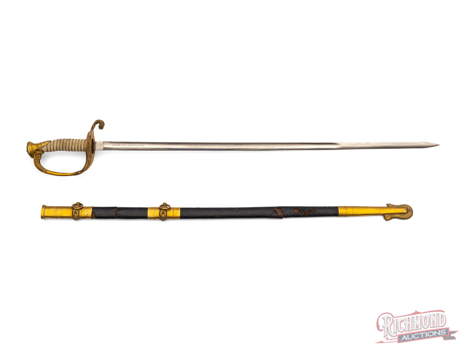 US Navy M1852 officer's Sword: This Sword features a 29" blade and measures 35 1/2" overall. The blade is decorated over half of the length with Naval images and the name "John H. A. Goulding". It is fitted with a brass handguard w