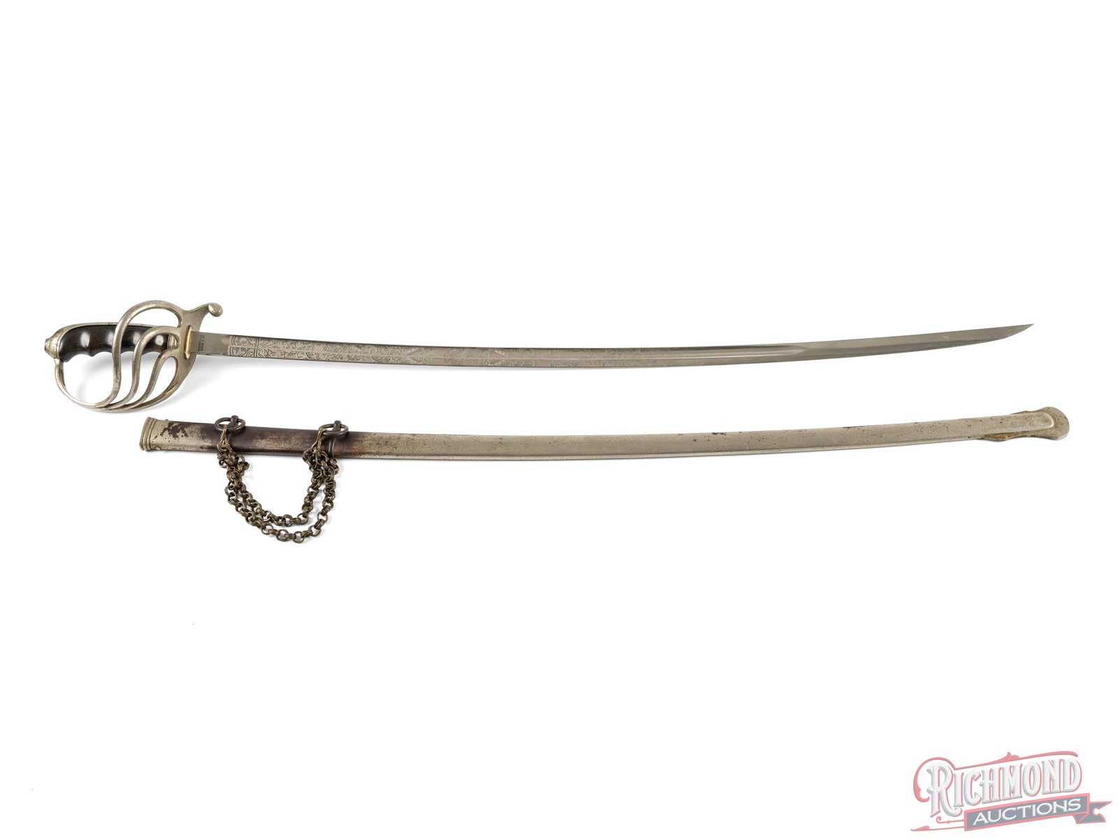 Model 1902 US officer's Sword Made by W. S. Kirk of Philadelphia: This is a model 1902 sword made by W. S. Kirk of Philadelphia. It features a 31 " blade and measures 37" overall. The blade is decorated and engraved with the letters "US" in the middle. the base of t