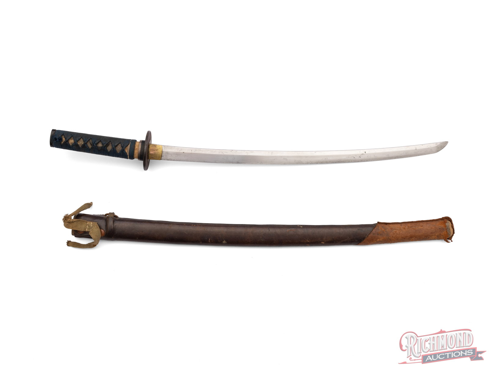 Unsigned Shin Shunto Japanese Sword: This Japanese sword features a 21" blade and measures 28 1/2" overall. It is fitted with around iron handguard with the handle wrapped in a blue ito over a crescent moon menuki. It is fitted into a le