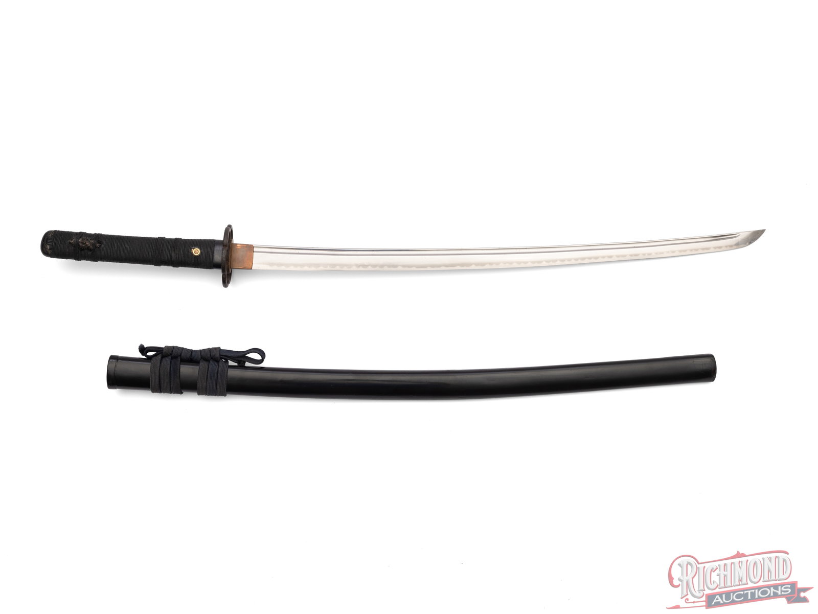 Nagata Sukenori Japanese Katana Sword: This Japanese sword features a 25 1/2" blade and measures 36" overall. The blade features a wavy visible temper line and copper colored blade collar. It is fitted with an iron handguard which has a
