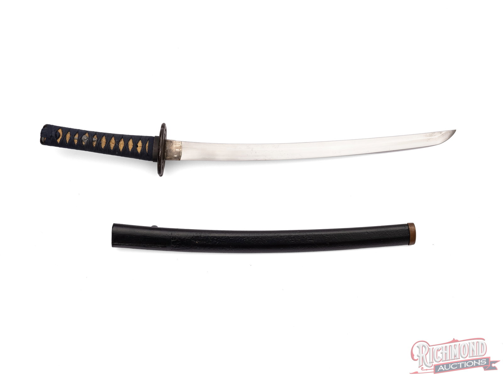 Mumei Wakizashi Japanese Sword: This Wakizashi sword features a 16 1/4" curved blade with light temper line. The iron handguard has a brown patina with some pitted areas and the grip is wrapped in a blue ito. Condition GOOD -