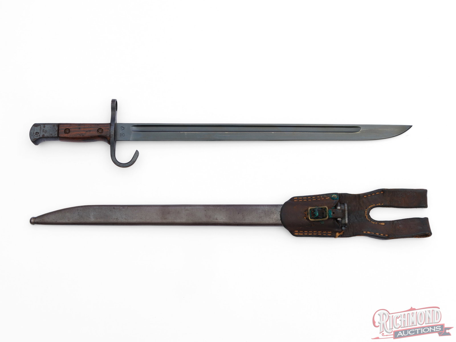Japanese Type 30 "Tokyo Hourglass" Bayonet With Scabbard And Frog: This Type 30 bayonet was made by Hikari Seiki Seisakusho Arsenal as it is marked with the Kokura arsenal mark with the "hourglass" marking and has the serial number marked on the pommel. Also