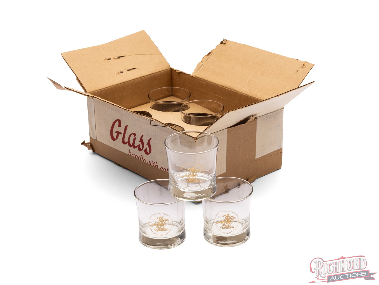 Set of Six Winchester 100th Anniversary Tumbler Glasses: This is a case of 6 glasses celebrating the 100th anniversary of Winchester (1866-1966). The glass has the Winchester-Western logo with "A century of Leadership". Glasses are 3 1/2" tall. Condition