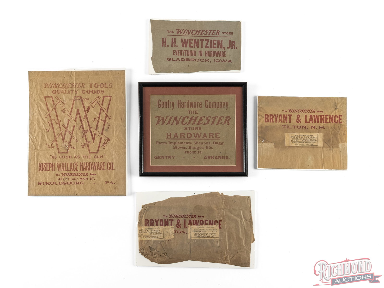 Five Brown Paper Cutouts From "The Winchester Store" Hardware Stores: This lot contains cut out brown paper advertisements from different hardware stores across the US. The stores included are from Gentry, AR (framed), Stroudsburg, PA, Gladbrook, IA, and Tilton, NH. Con