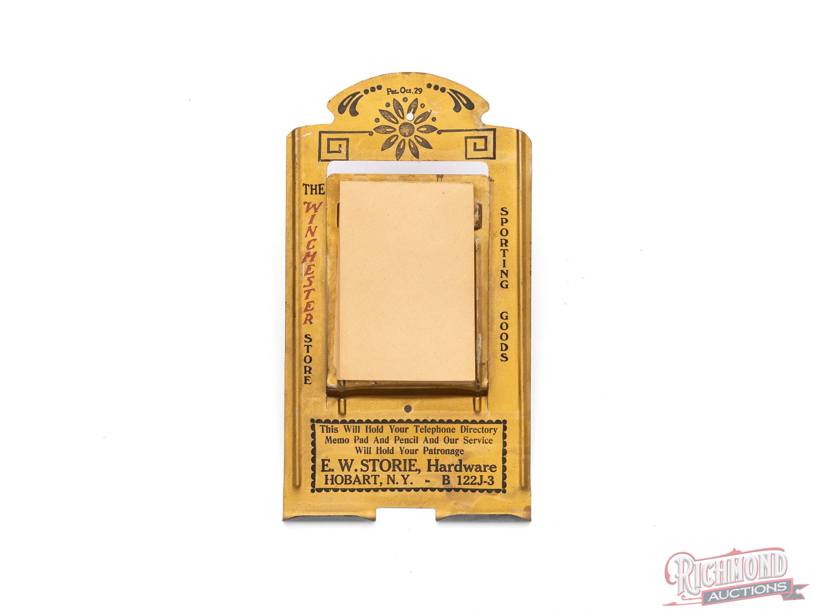 The Winchester Store Memo Pad & Directory Holder, E. W. Storie Hardware NY: This memo pad and directory holder was made to keep near your phone for messages, a place to keep your directory, and have a pencil ready! It advertised the Winchester Store and Sporting Goods. this