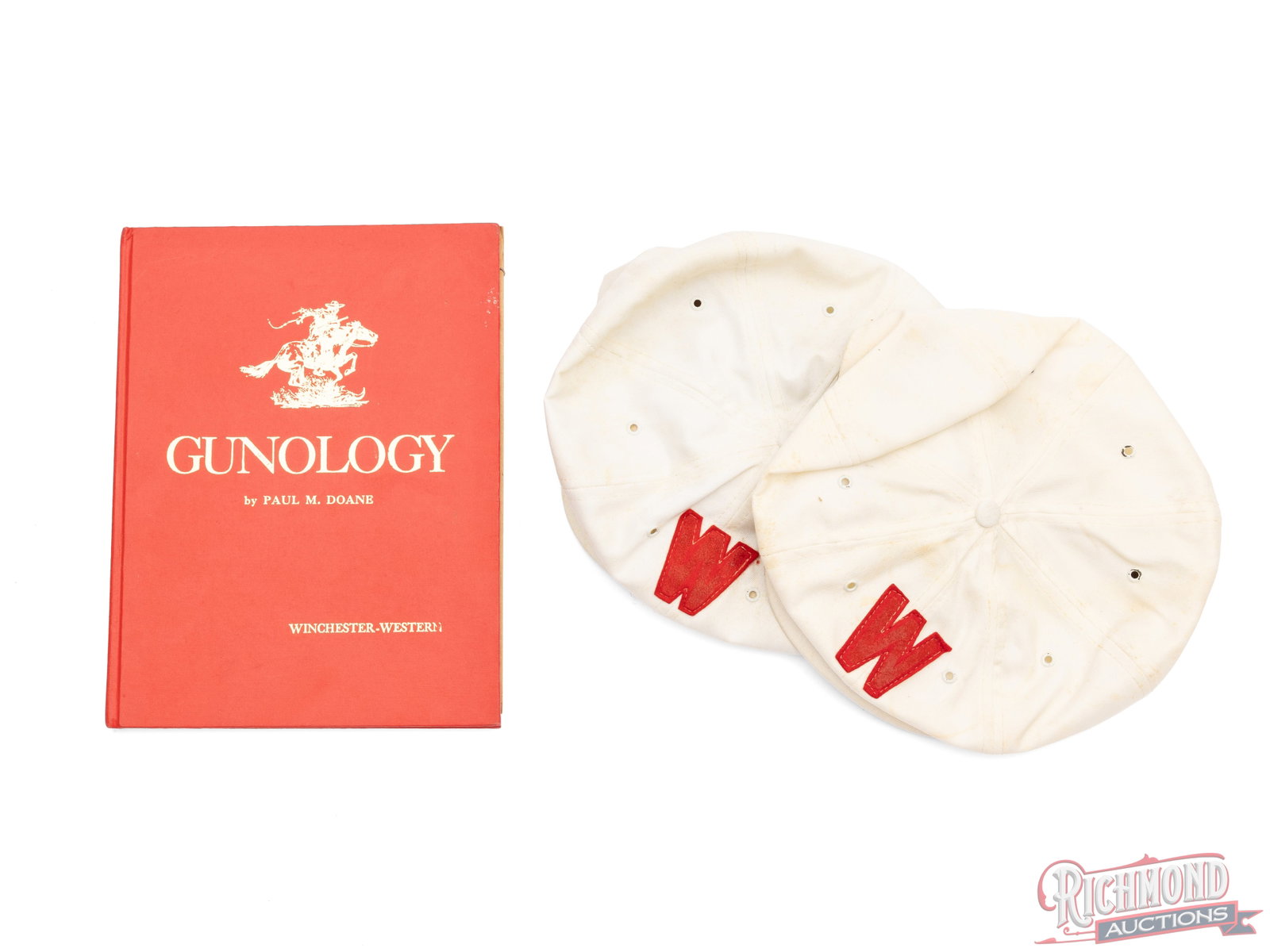 Autographed Copy of "Gunology" By Paul M. Doane and 2 Winchester Shooting Team Hats: This Winchester-Western book "Gunology" was written by Paul M. Doane and autographed with a written note and dated April 1965. Inside the cover of the book is a black and white photo of the Winchester