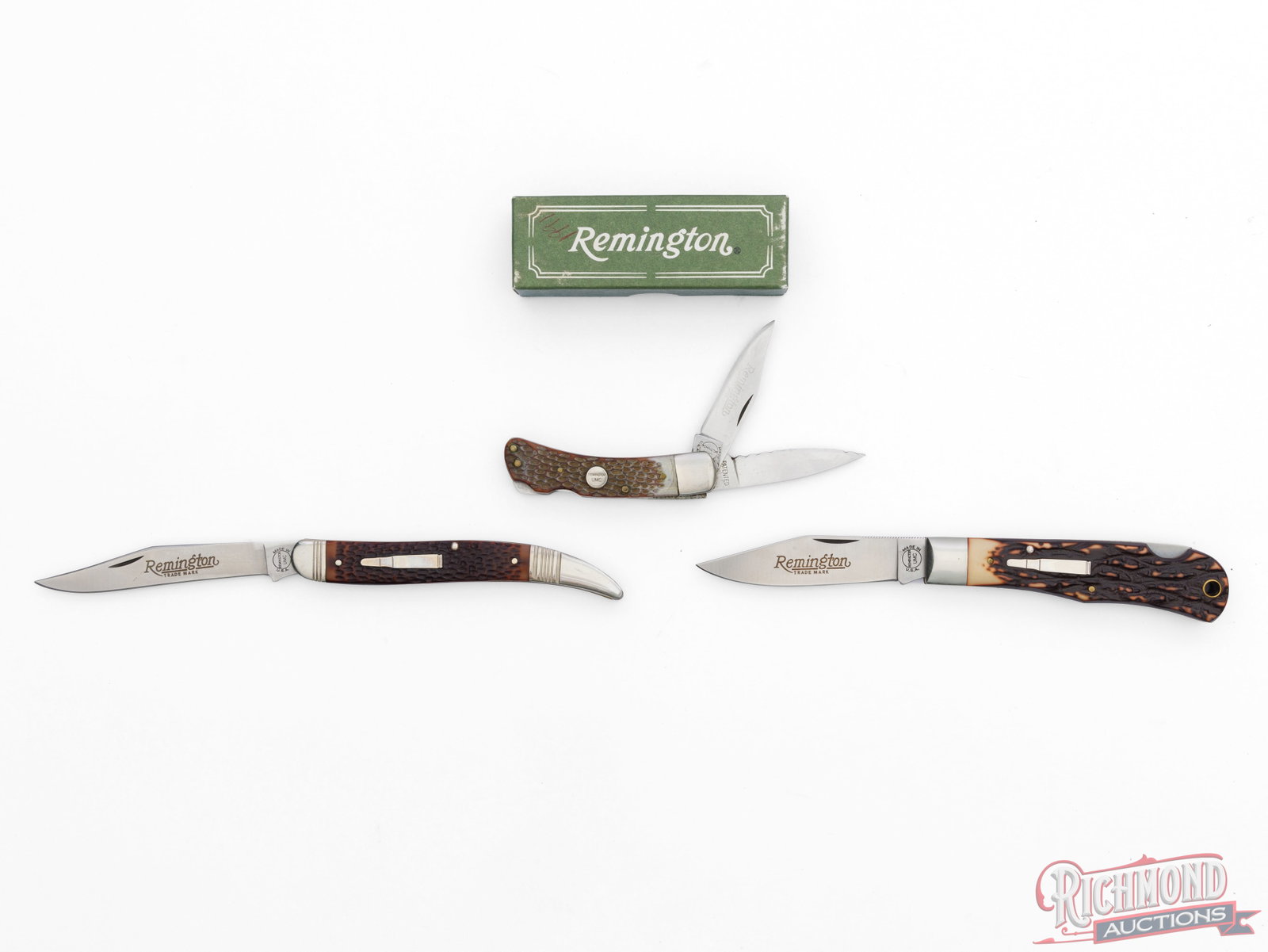 Two Collector Remington UMC "Bullet Knives" & R11 Handyman in Factory Box: This lot includes three Remington UMC folder knives. One model R11 Handyman Lock-Back features two 2" blades, one serrated shows wear, brass liners, nickel bolster and jigged Delrin handles. Measures