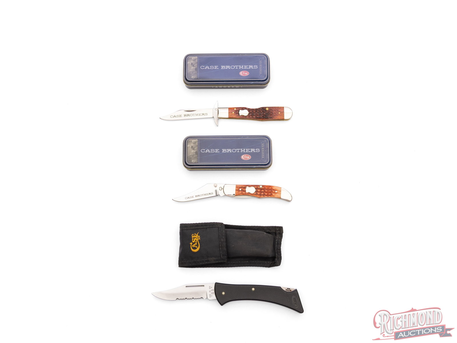 Three Case XX Folder Knives Two Case Brothers in Original Tins: Three Case XX knives. Two Case Brothers series in the original tins with leather protectors. One model 6111 1/2 L Cheetah with Chestnut jigged bone handle and silver shield medallion. One model 61265L