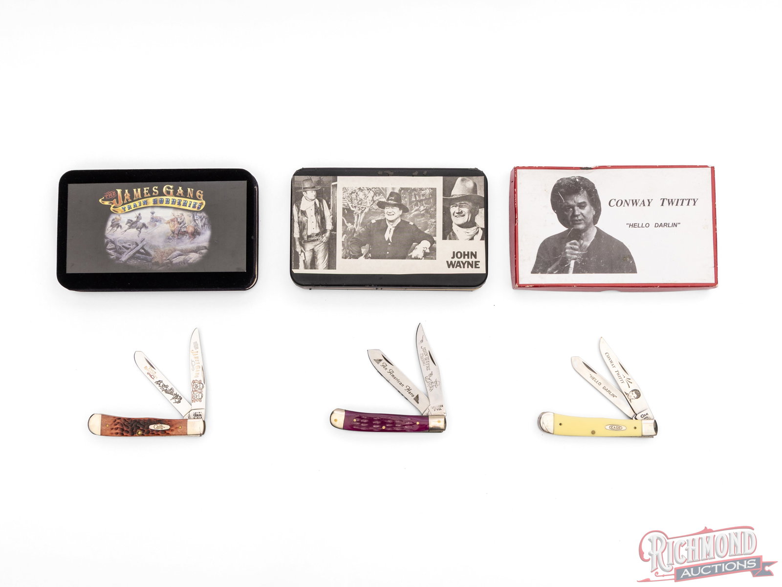 Three Commemorative Trapper Knives John Wayne, Conway Twitty & James Gang Two Case XX: All three are Trapper style in the original boxes. One Case XX Conway Twitty with etched "Hellow Darlin" blades and yellow Delrin handles. One Case XX James Gang etched "Train Robberies" blades with