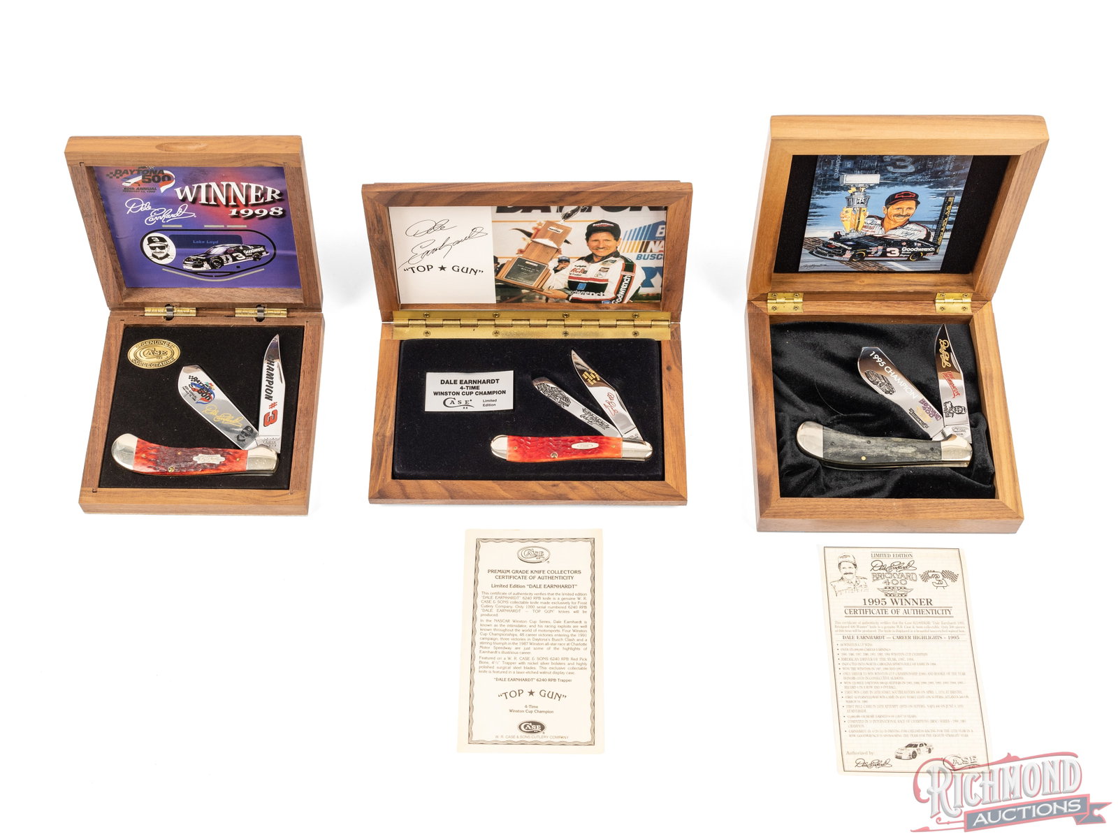 Three Case XX Limited Edition Dale Earnhardt Commemorative Knives in Original Cases: All three are Case XX brands in their original wood display cases. One model 62100 SS Saddlehorn Trapper with two etched blades "1998 Daytona 500 Winner" and dark red jigged bone handles. One model