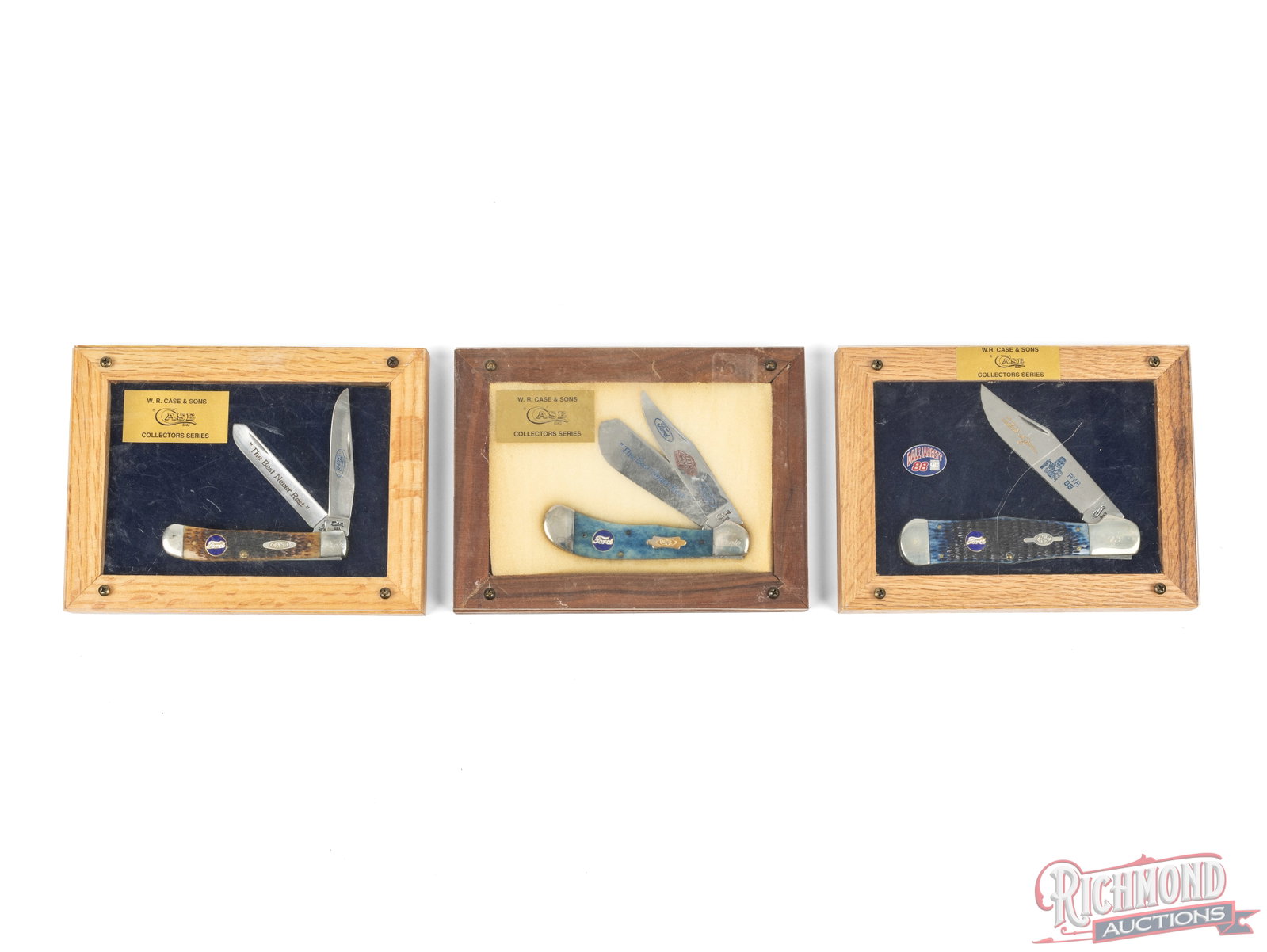 Three Case XX Ford Series Folder Collector Knives in Display Cases: All three are Case XX brand folder knives with Ford medallions in wood and plexi-glass display cases. One Trapper style features two etched blades, smooth blue bone handles. One Trapper style features