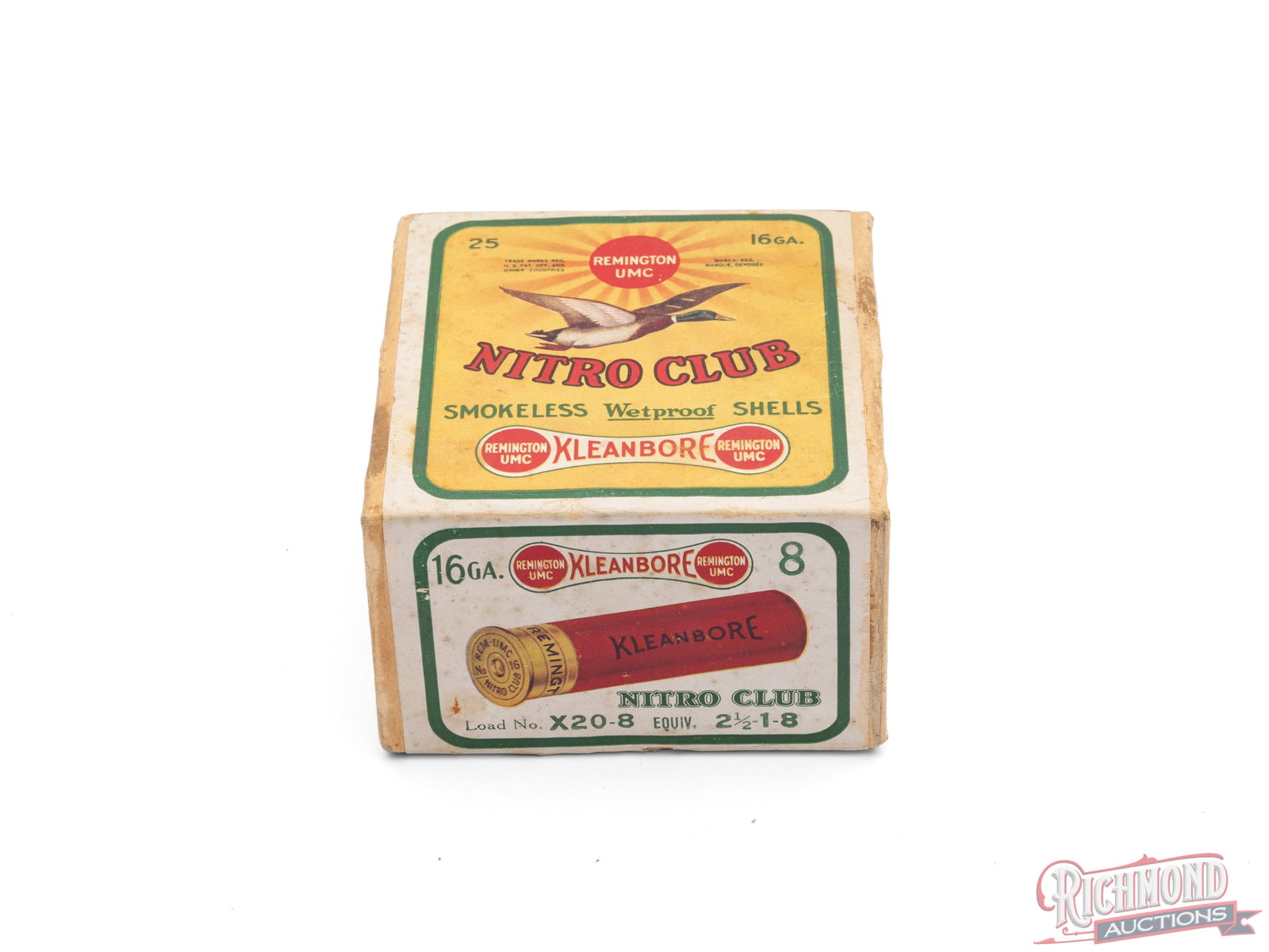 Sealed Box of Remington UMC Nitro Club 16 Gauge With Flying Duck Graphic: This is a sealed box of 16 gauge Nitro Club shells made by Remington UMC. The yellow and green label features the sunburst logo, flying mallard, and the Kleanbore dogbone with the call outs