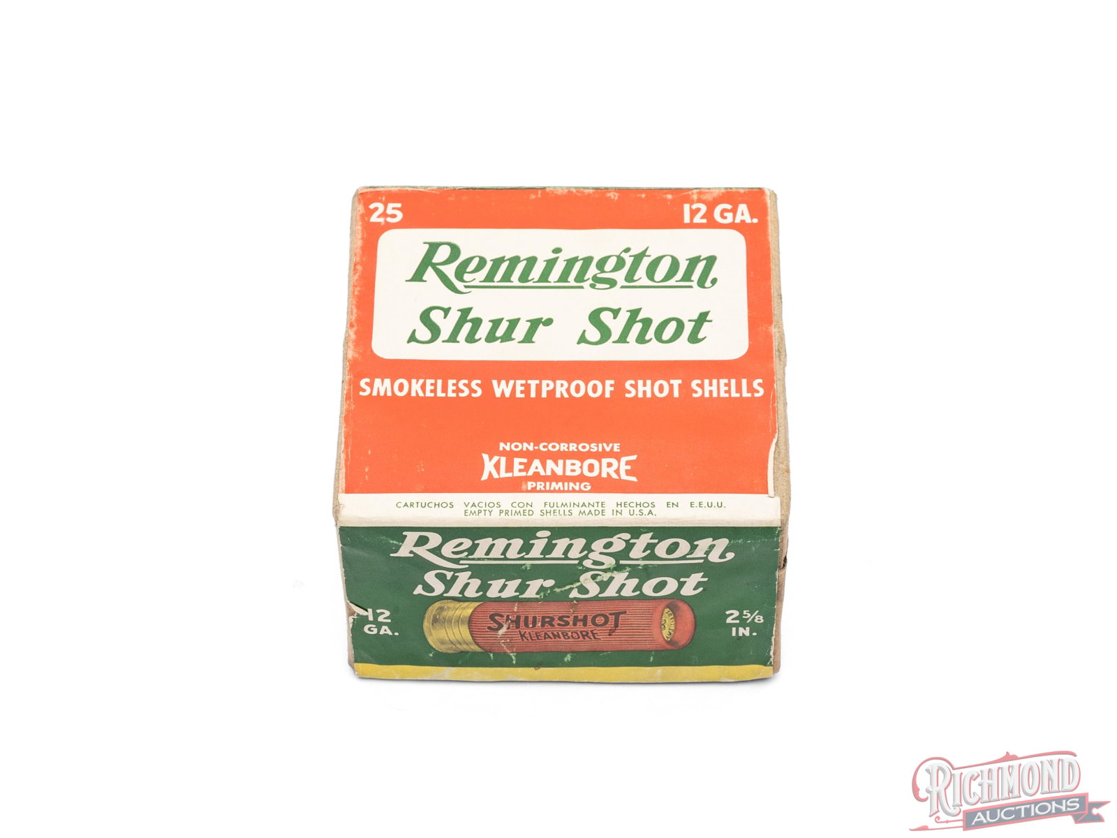 Full Box of Remington Shur Shot 12 Gauge 2 5/8" Smokeless Wetproof Shot Shells: This two piece box contains 12 gauge 2 5/8" Shur Shot shells made by Remington Arms Co. The box has a bright red and green label that is uncut at the seal, becoming unglued, and folded inside the