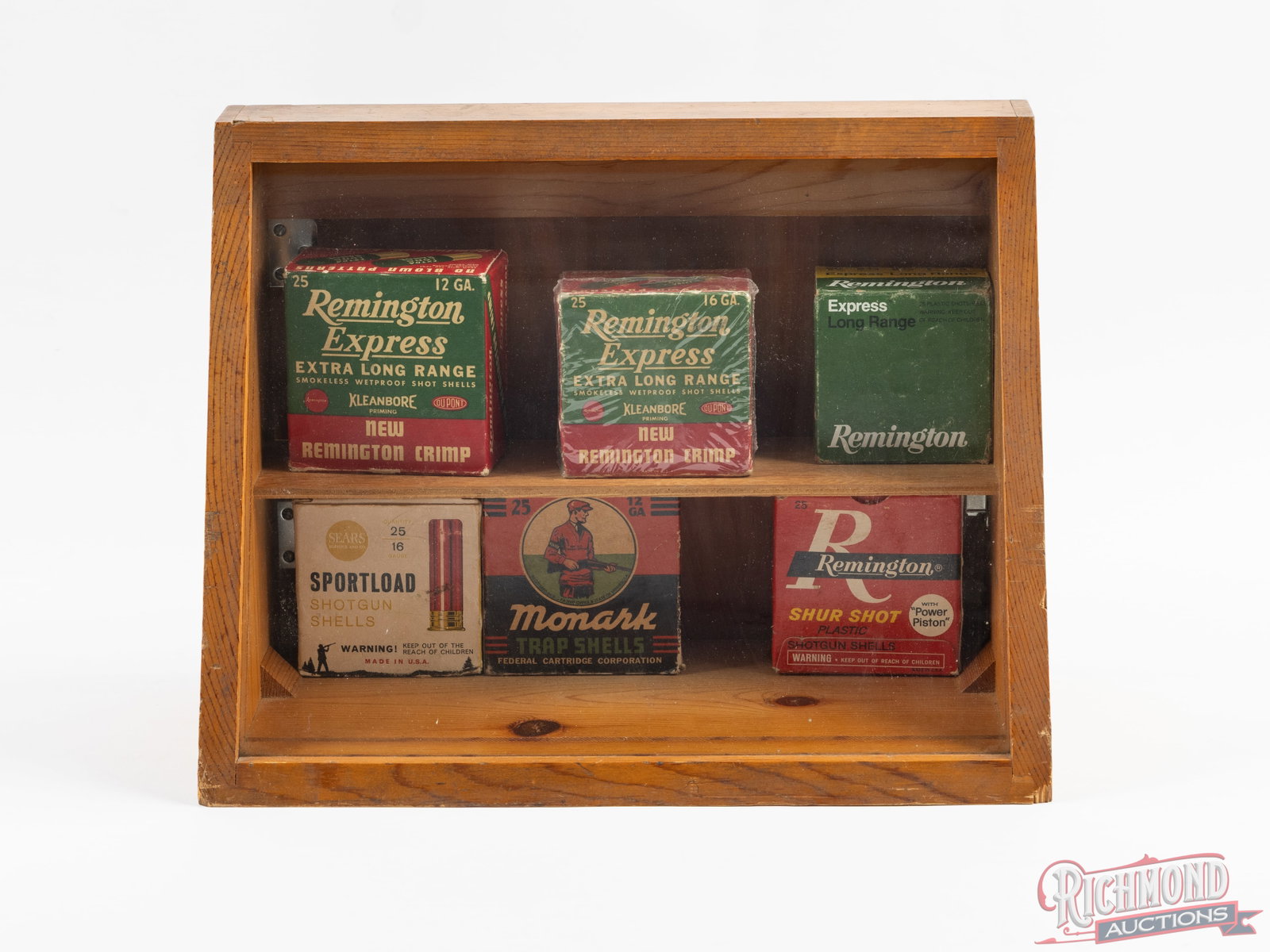 Wood Display Case With Remington, Federal & Sears Collector Shotshell Boxes: Ready to display! Hand-made wood counter display case with glass front has an interior shelf for ammunition storage. Measures 16-1/2" wide, 12-1/4" tall and 8-1/2" deep. Includes 6 collector shotshell