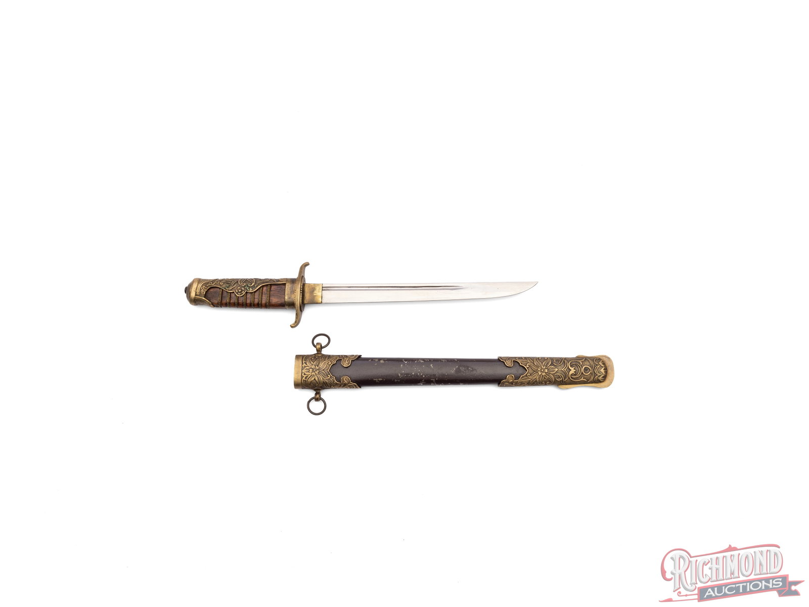 WWII Era Manchurian officer's Dagger: This officer's dagger features a 9" single sided blade and measures 14" overall. It come in a decorated scabbard and features an ornate cherry blossom on the scabbard and grip. Condition VERY GOOD