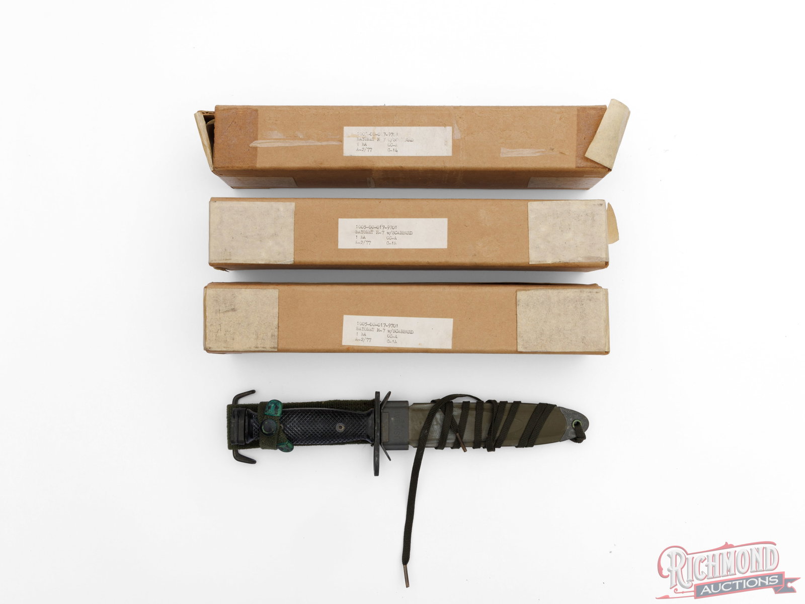 3 Boxed US M7 Bayonets USM8A1 With Scabbards: This lot contains 3 US M7 bayonets with original boxes, 2 of which are unopened. Each bayonet measures 12" overall with a 6 3/4" blade. Each box is labeled with " Bayonet M-7 w/scabbard, 1 ea.".