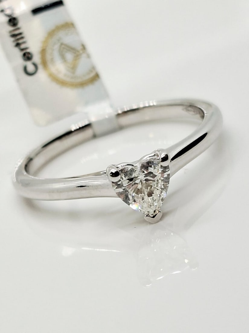 0.41ct Heart Brilliant Diamond Solitaire Ring - 18k White Gold - IGI Certified G VS1: Romantic Natural Diamond Solitaire Ring - Exceptional Clarity & Colorless BrillianceCertification: IGI Jewelry Report #10J2162625Stock Number: R-002Metal: 18K White Gold (Stamped "750" and engraved "X