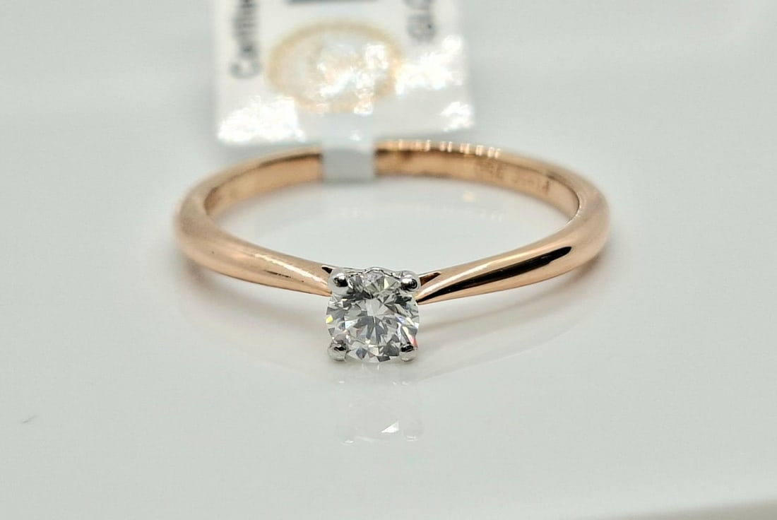 0.20ct Round Brilliant Diamond Solitaire Ring - Platinum & 18k Pink Gold - IGI , E-F Color: Elegant Two-Tone Natural Diamond Solitaire Ring - Exceptional Colorless QualityCertification: IGI Jewelry Report #10J2162225Stock Number: R-004Metal: Platinum & 18k Pink Gold (Stamped "750 Pt950 XM")T