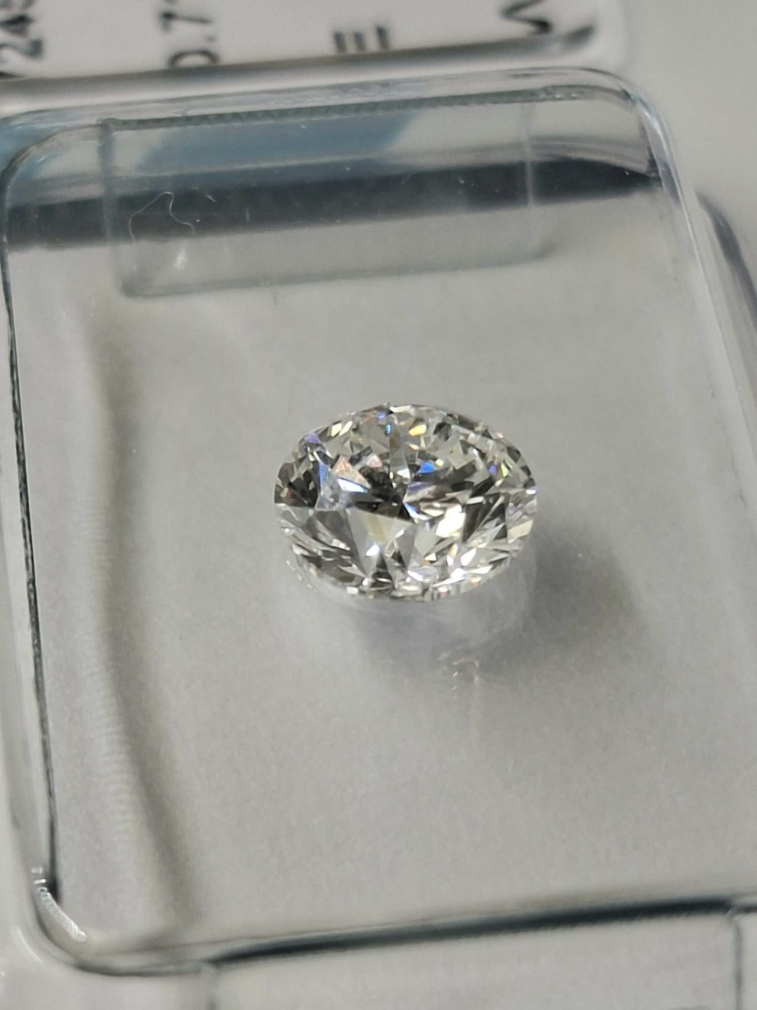 0.71 Carat Round Brilliant Natural Diamond - IGI Certified - E Color / VVS1 - Sealed - 4