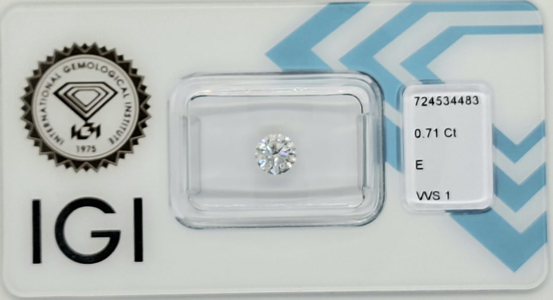 0.71 Carat Round Brilliant Natural Diamond - IGI Certified - E Color / VVS1 - Sealed - 6
