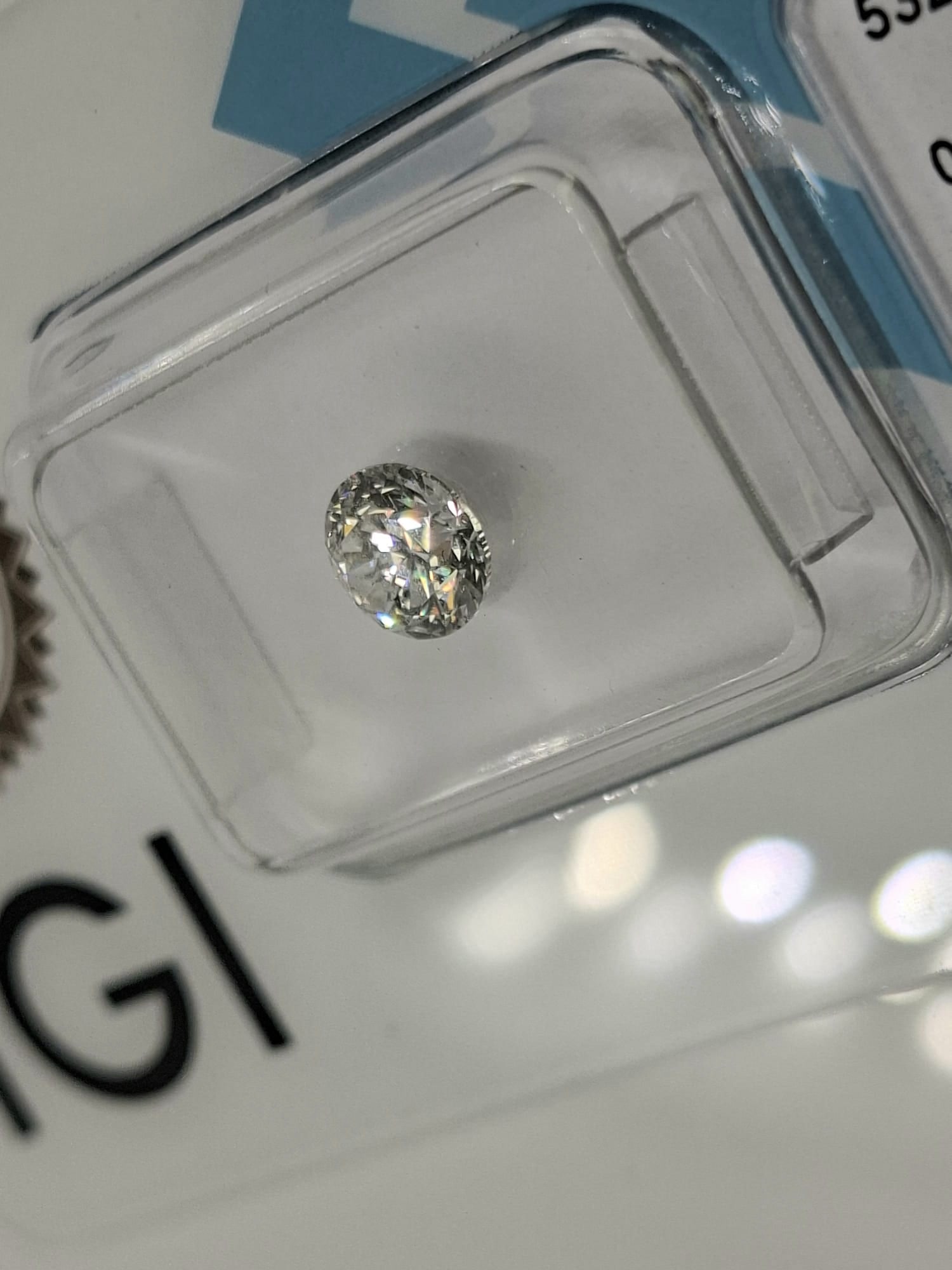 0.72 Carat Round Brilliant Natural Diamond - IGI Certified - E Color / SI2 - Sealed - 5