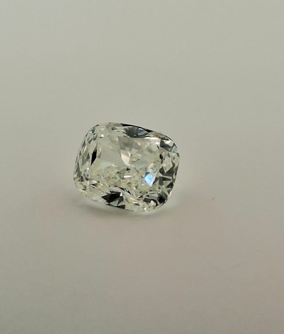 0.93 Carat K / VS2 Cushion Modified Brilliant Diamond - GIA Certified: 0.93 Carat K / VS2 Cushion Modified Brilliant Diamond Official GIA Certified • Natural Earth-Mined • Cushion Modified Brilliant • Strong Blue Fluorescence Official Certificate Details