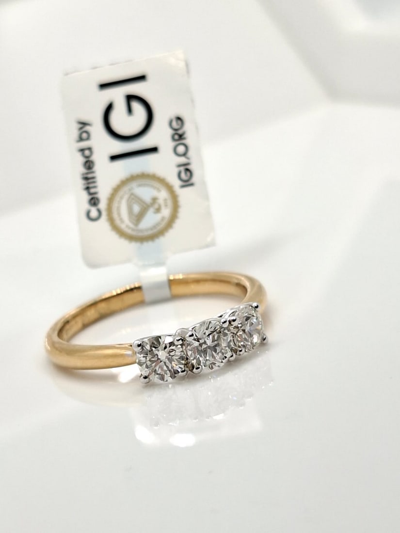 0.70 CTW Three-Stone Natural Diamond Ring - F-G / VS - 18K Yellow & White Gold - IGI Certified: 0.70 CTW Three-Stone Natural Diamond Ring (18K Yellow & White Gold) Official IGI Certified • Rare F-G / VS Grade • Two-Tone 18K Gold Setting Official Certificate & Item Details IGI