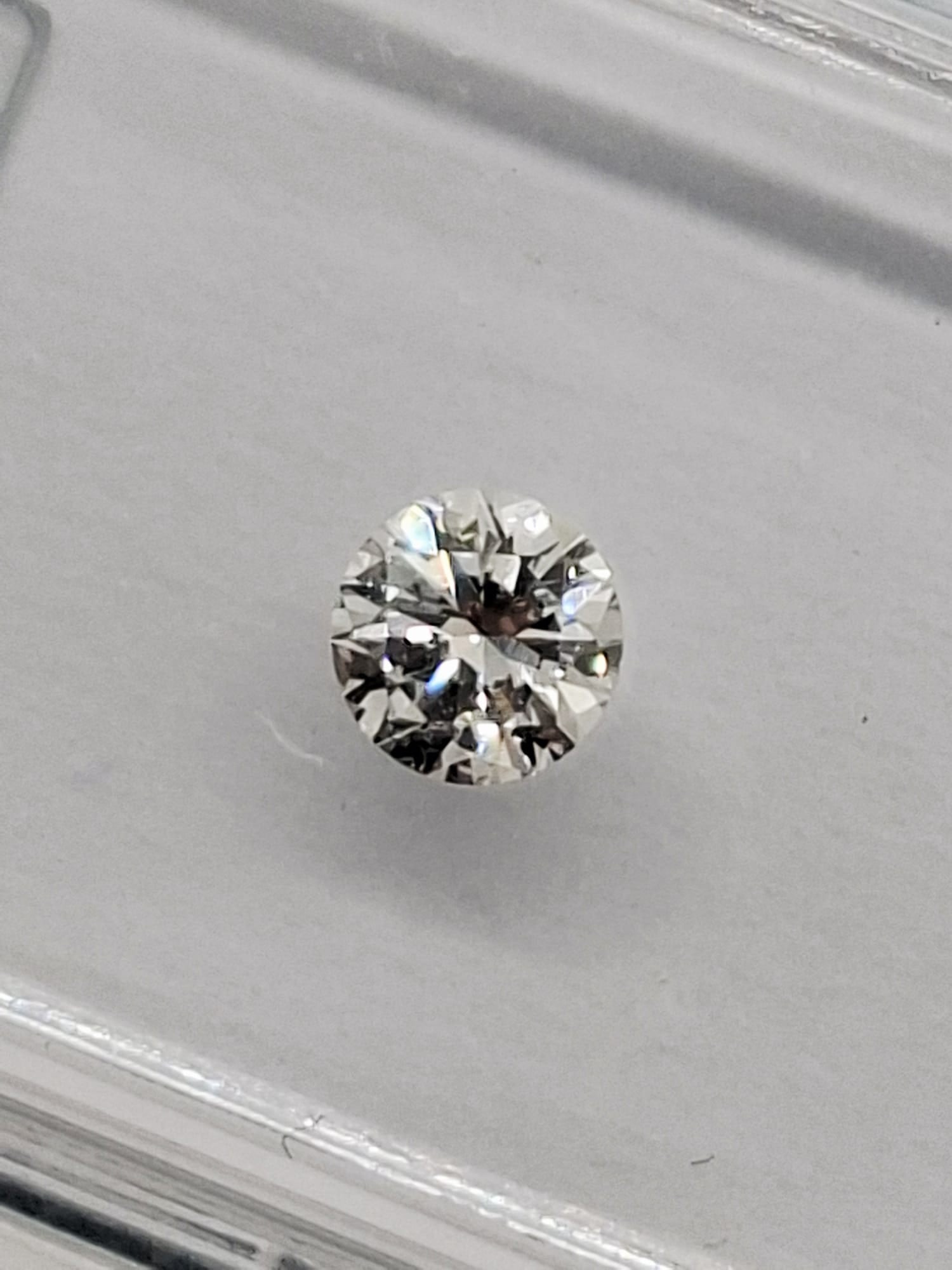 0.46 CTW Pair Round Brilliant Diamonds (0.23 CT Each) - F Color - VVS1 Clarity - IGI Certified (Seal - 4
