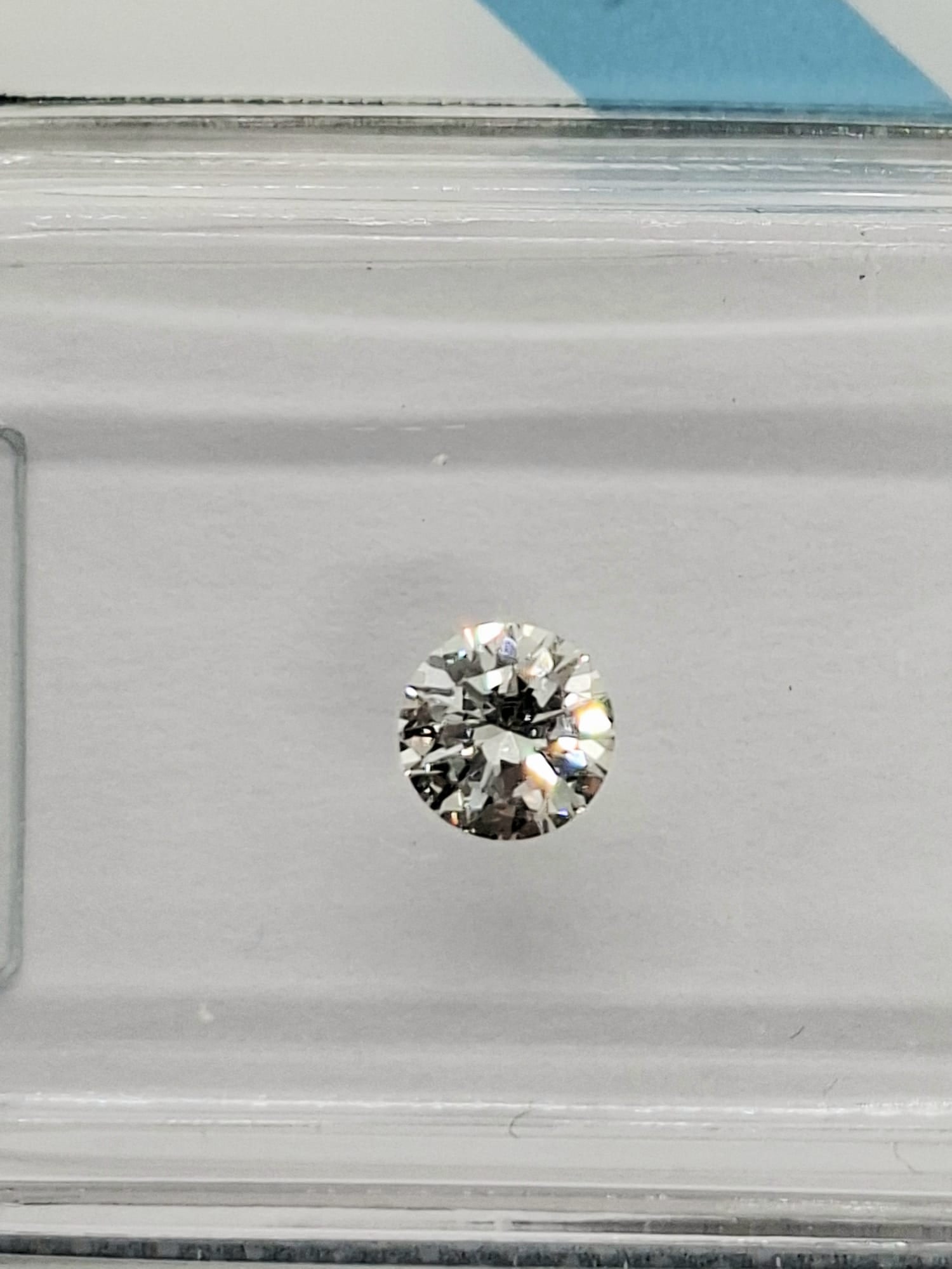 0.46 CTW Pair Round Brilliant Diamonds (0.23 CT Each) - F Color - VVS1 Clarity - IGI Certified (Seal - 7