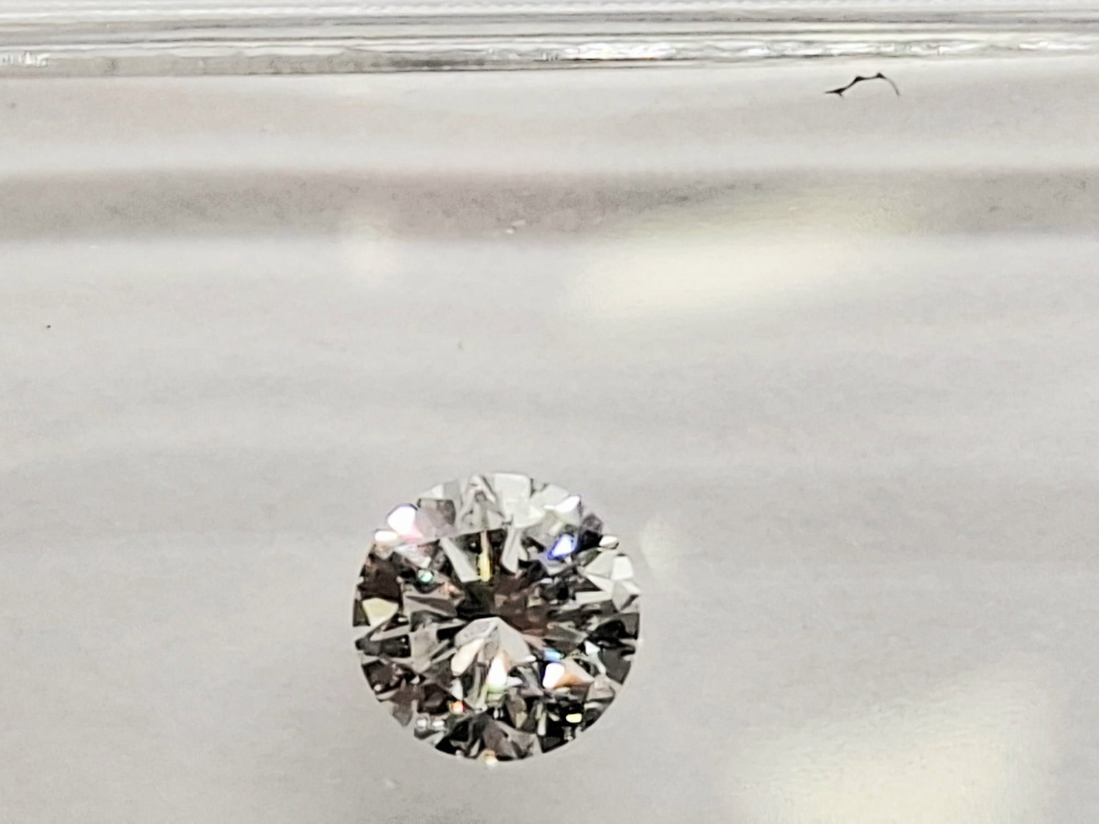 0.46 CTW Pair Round Brilliant Diamonds (0.23 CT Each) - F Color - VVS1 Clarity - IGI Certified (Seal - 8