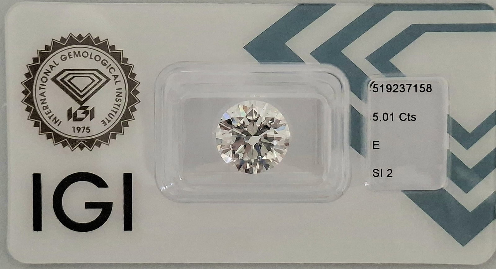 5.01 CT Natural Round Brilliant Diamond E SI2 Triple Excellent IGI Certified Sealed: 5.01 Carat Natural Round Brilliant Diamond IGI Certified Report #519237158 • Sealed CertiCard • Exceptional E Color • 3x Excellent Investment-Grade Statement Gem: An impressive, rare
