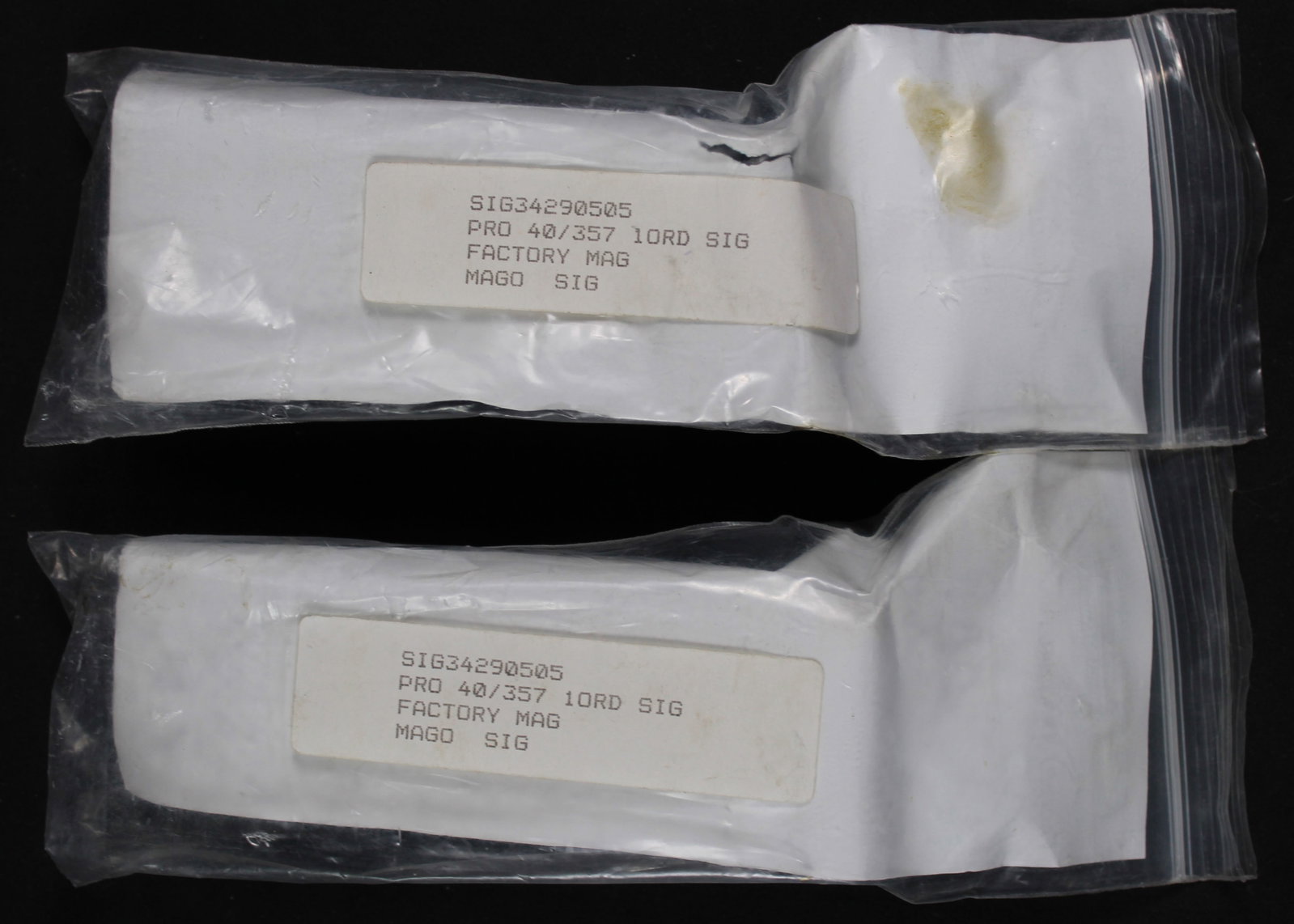 Group Lot: Two 10-Round Sig Sauer Magazines .40; Two 10-Round Sig Sauer Magazines 9x19mm (HRR) - 2