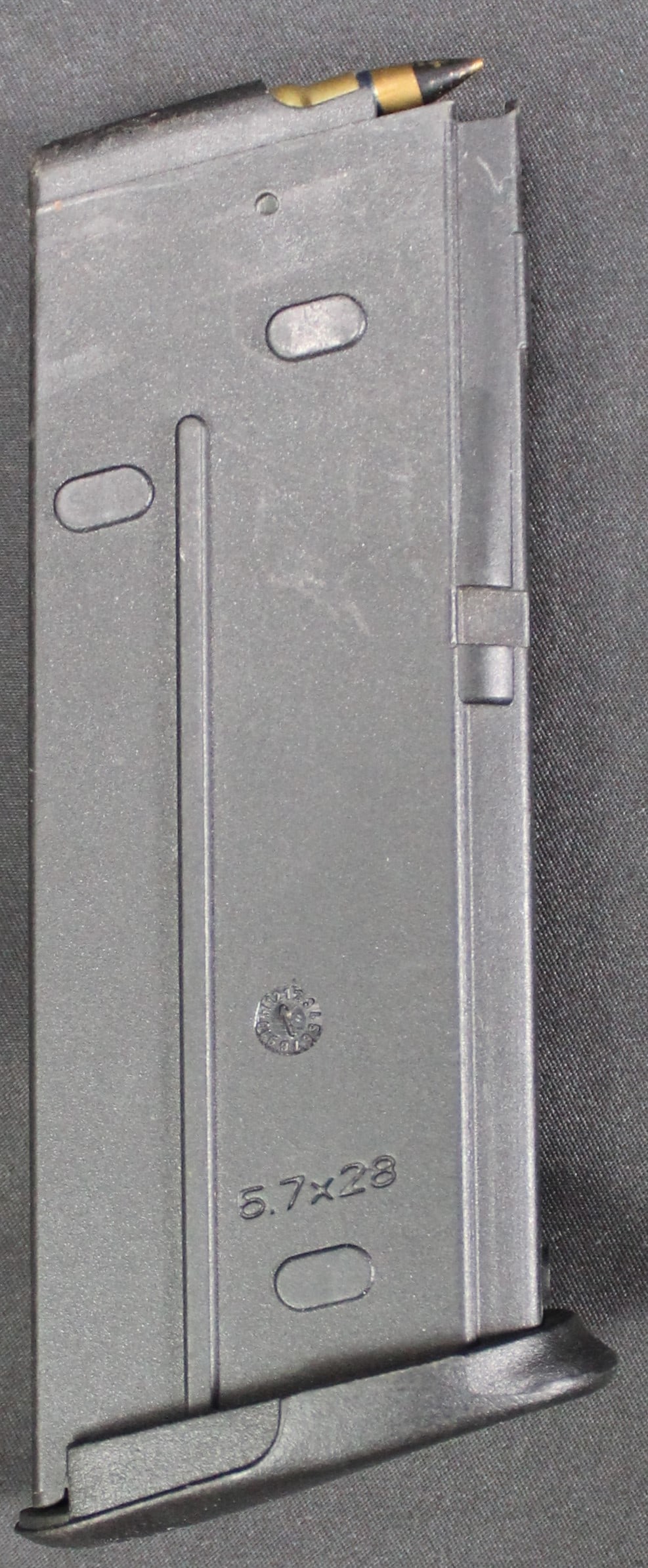 FN Five-Seven 20 Round 5.7x28mm Magazine (FMI): FN Five-Seven 20 Round 5.7x28mm Magazine in very good condition. The magazine is a polymer construction manufactured by FN in Belgium. Magazine comes with 2 rounds.