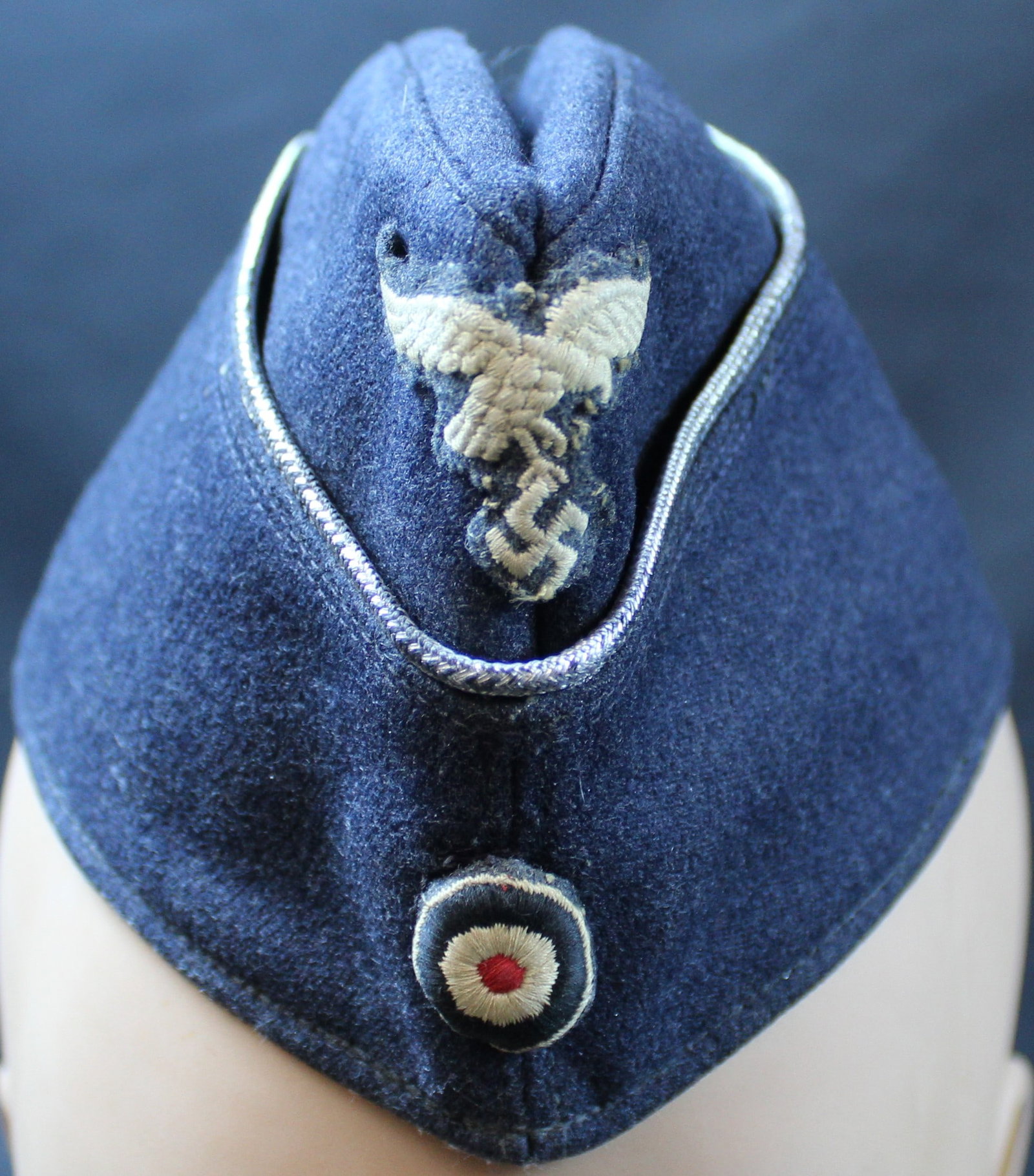 Rare Authentic WWII German Luftwaffe Overseas Cap (MME): A rare WWII German Luftwaffe overseas cap in good to very good condition overall. The Luftwaffe emblem and NSDAP insignia sits prominently on the front of the cap and appears to be original. The