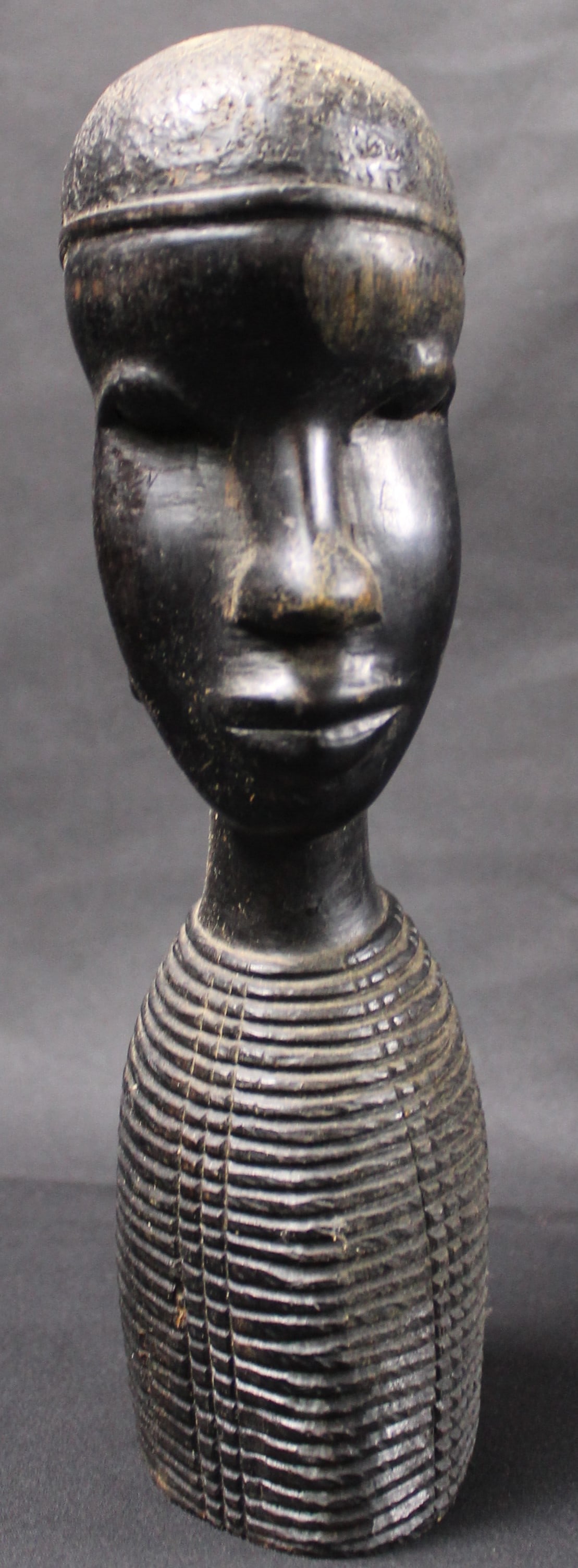 Hand Carved Kenyan Tribal Man's Bust (FMA): Estimated shipping parcel size (LxWxH) 10 inches x 8 inches x 8 inches. Please note, shipping estimates are provided for LiveShipping calculations only and may vary based on weight and location. The