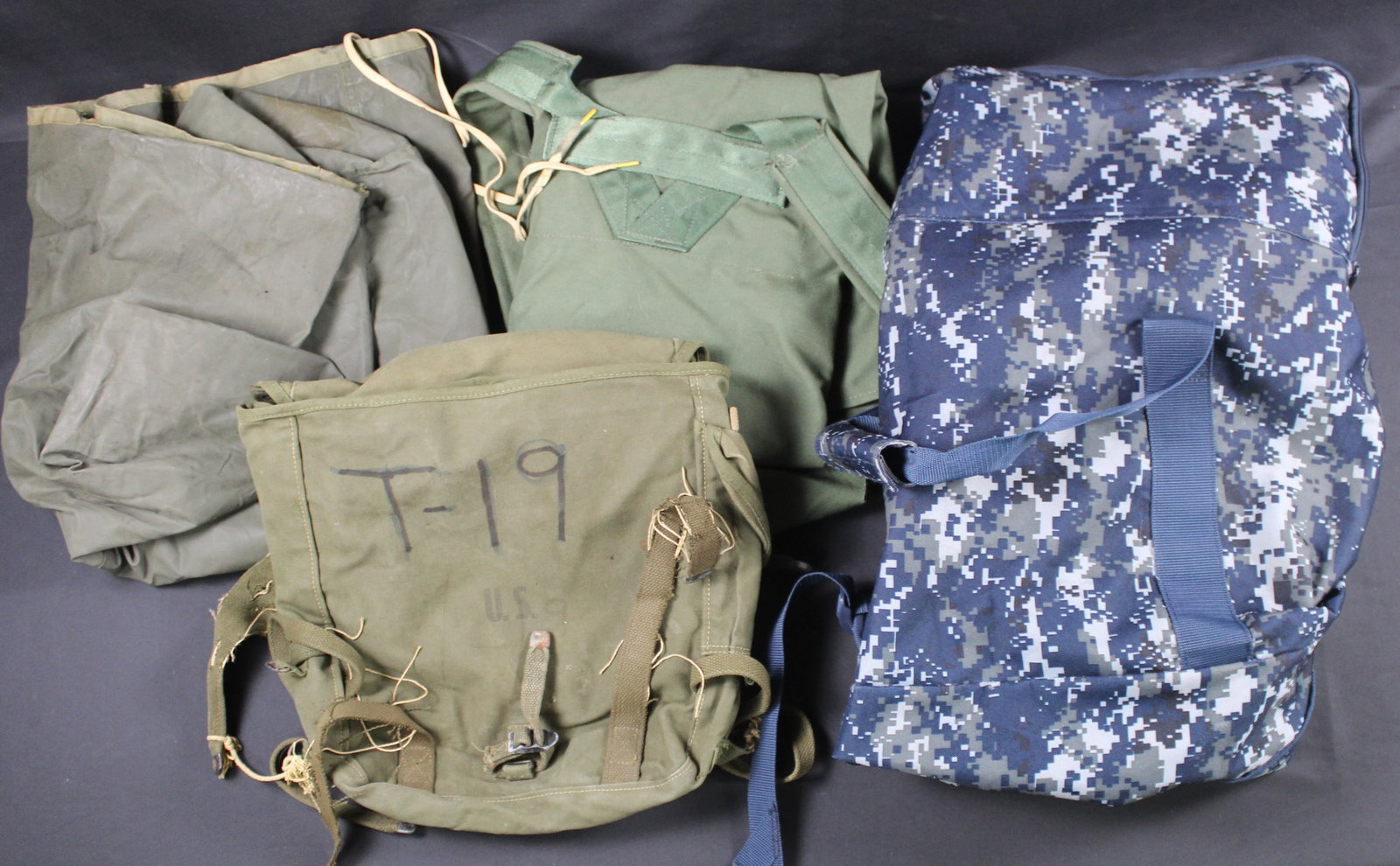 Table Lot: 4 US Military Items Including New NAvy Duffle, Sea Bag, WWII US Pack & a Cover (MDX): Estimated shipping parcel size (LxWxH) 10 inches x 8 inches x 8 inches. Please note, shipping estimates are provided for LiveShipping calculations only and may vary based on weight and location. The