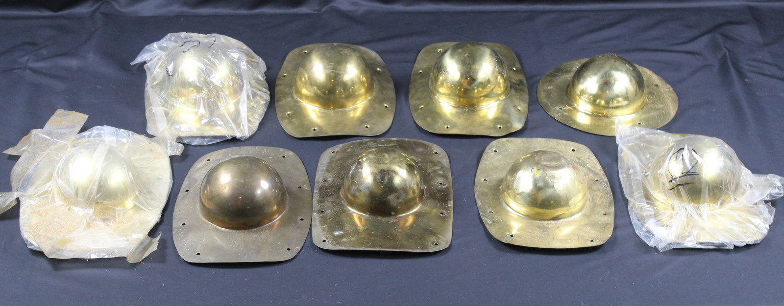Nine Brass Roman Shield Bosses (PMC): Nine Roman Shield Bosses (PMC) Estimated shipping parcel size (LxWxH) 10 inches x 10 inches x 10 inches. Please note, shipping estimates are provided for LiveShipping calculations only and may vary ba